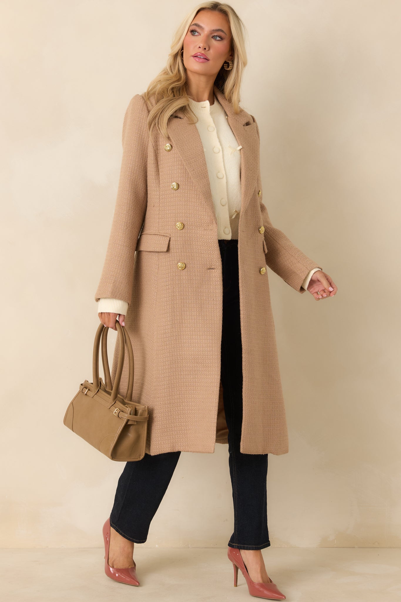 Front-facing view highlighting the notched lapels and gold-tone button closures on the camel coat.