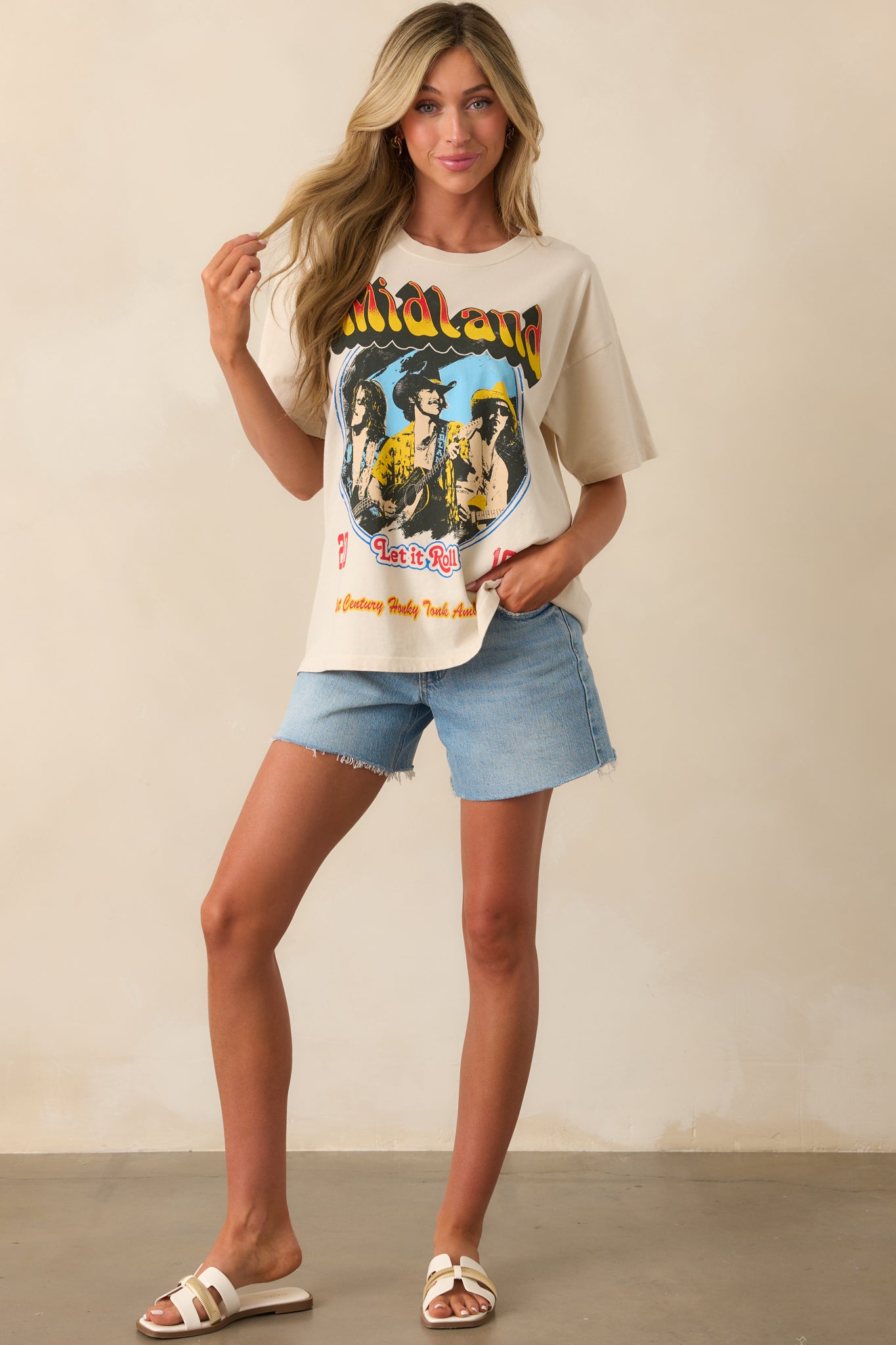 Another front view highlighting the crew neckline, short sleeves, and the oversized silhouette of the tee.