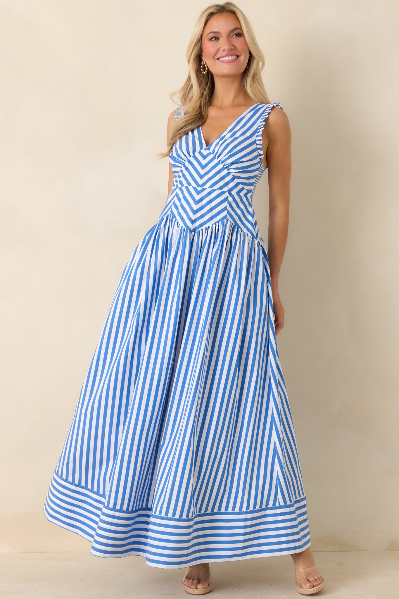 Angled front view highlighting the structured bodice and mixed stripe pattern placement.