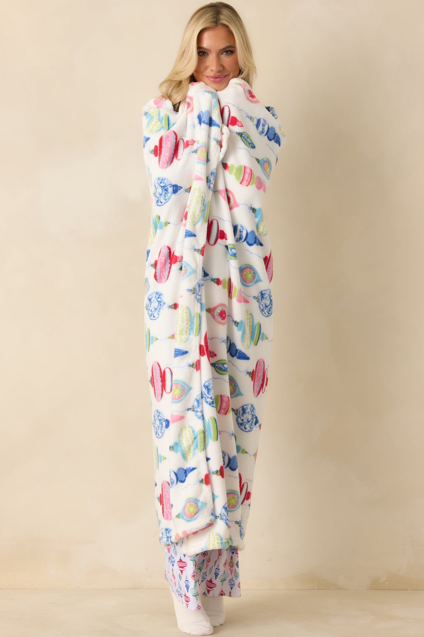 Front-facing view emphasizing the straight edges and vibrant holiday print on the blanket.