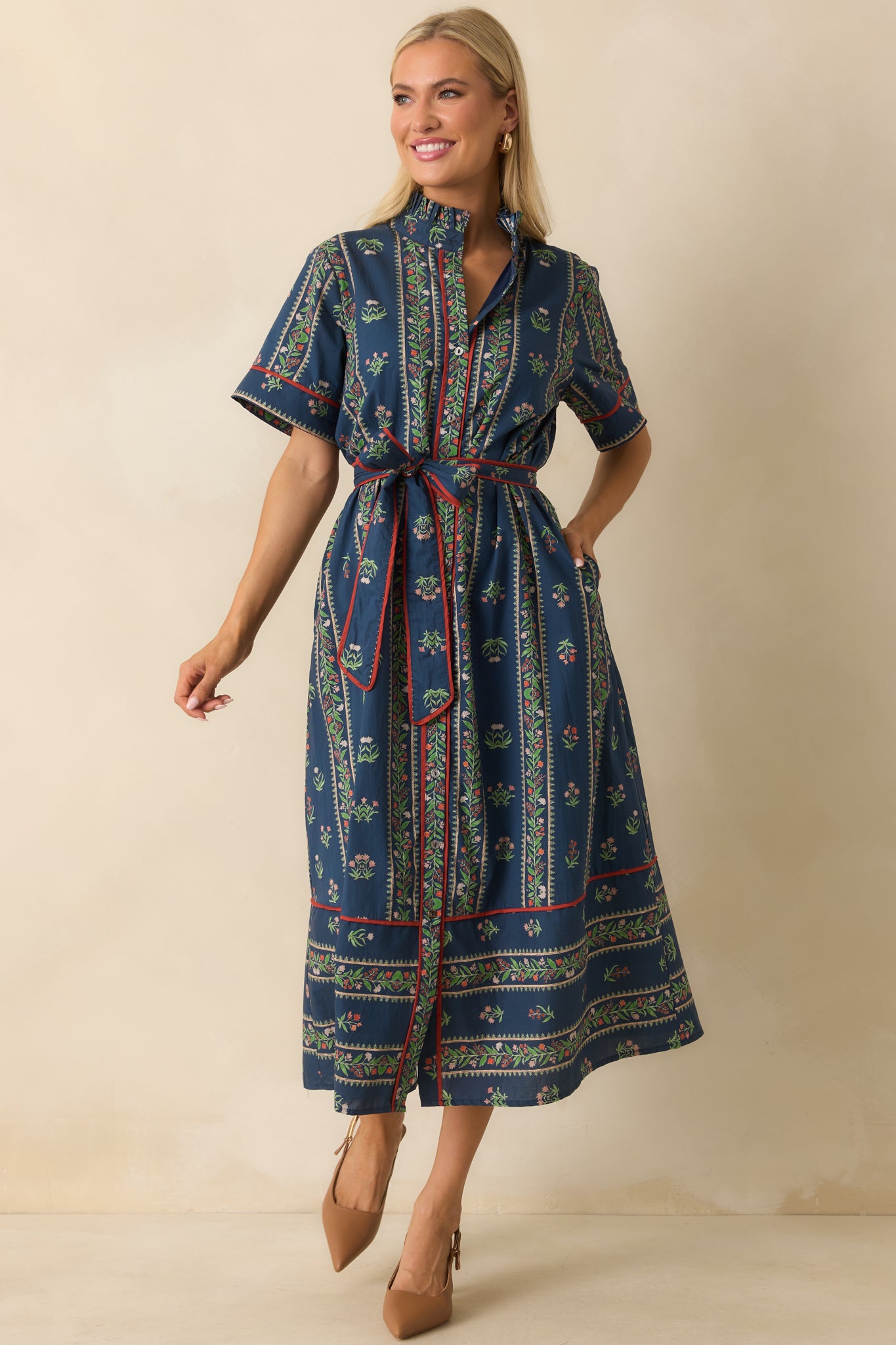 Front view of maxi dress emphasizing ruffle neckline, short sleeves, and multicolor pattern.