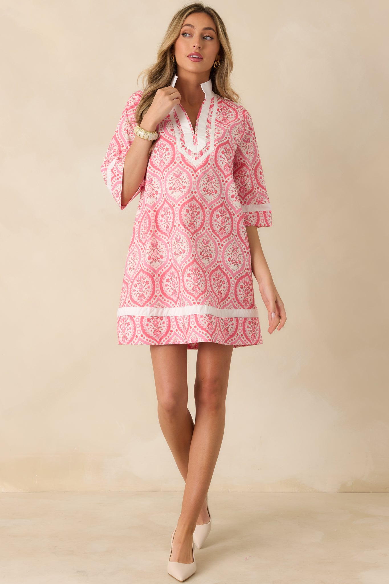 Front-facing full length image highlighting the lightweight cotton fabric and straight mini-length hemline.