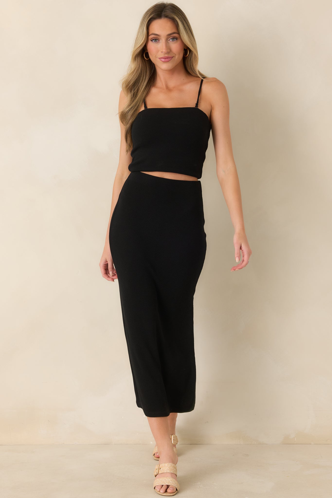 Front view of black strapless top showcasing smooth fit and clean, minimal design.