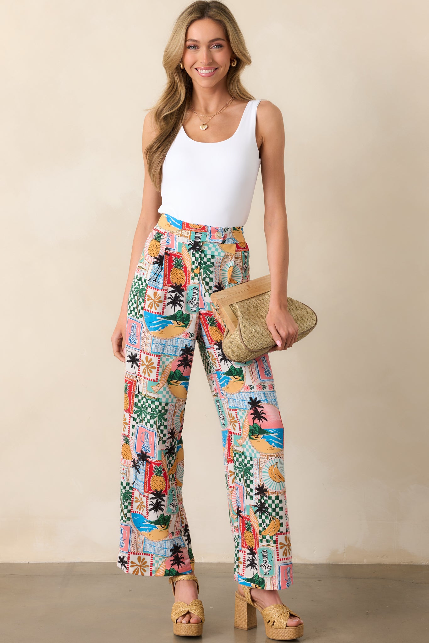 Front view of tropical pants featuring a high waisted fit, zipper closure, and straight leg design.