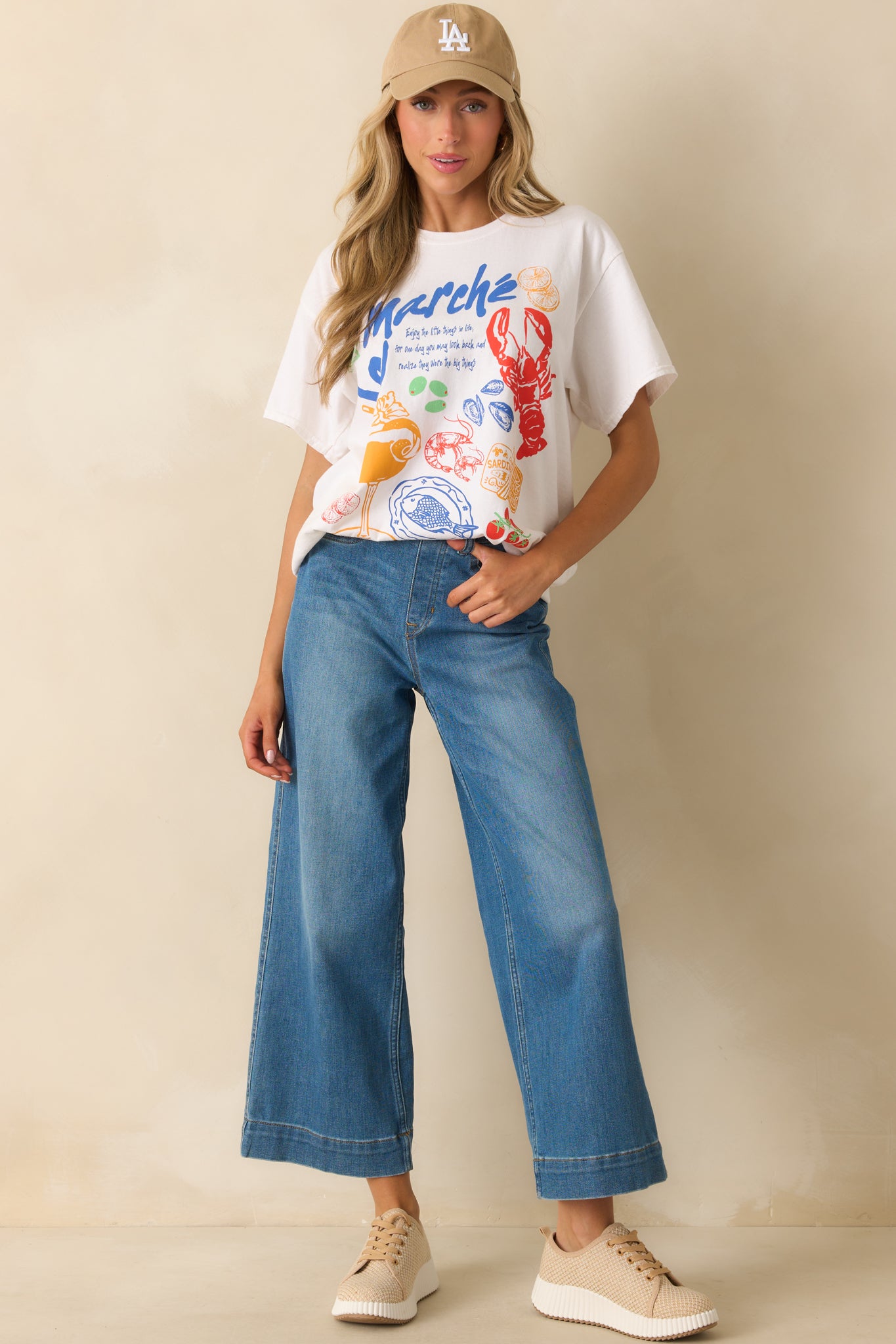 Front view of white cotton t-shirt highlighting relaxed oversized fit and vibrant multicolor graphic.