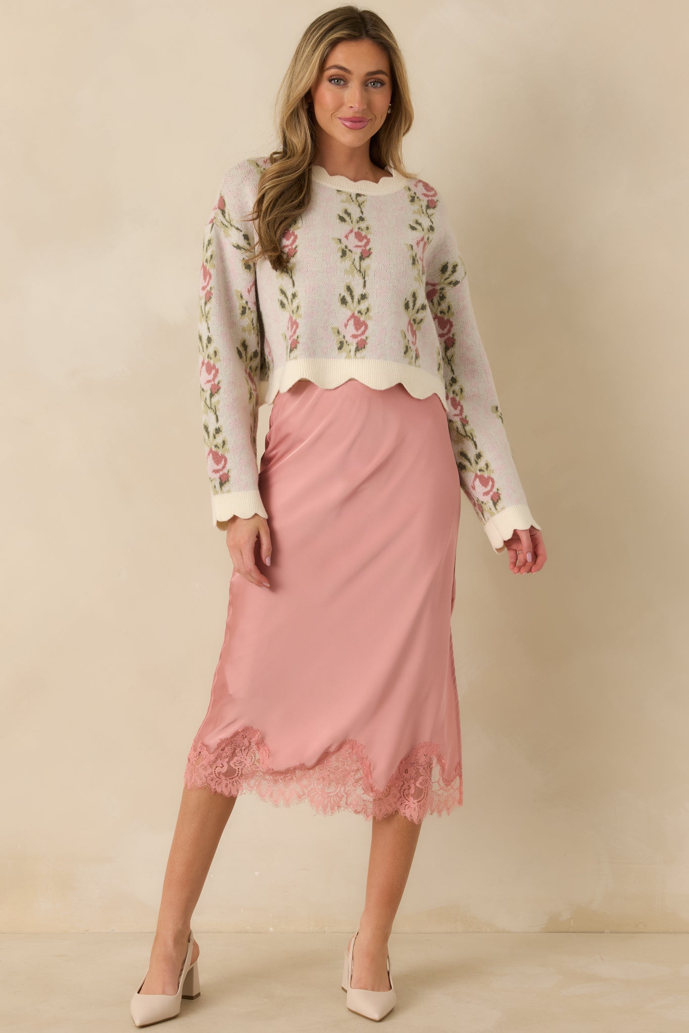 Front-facing view of the blush midi skirt showcasing the smooth satin finish and fluid drape.