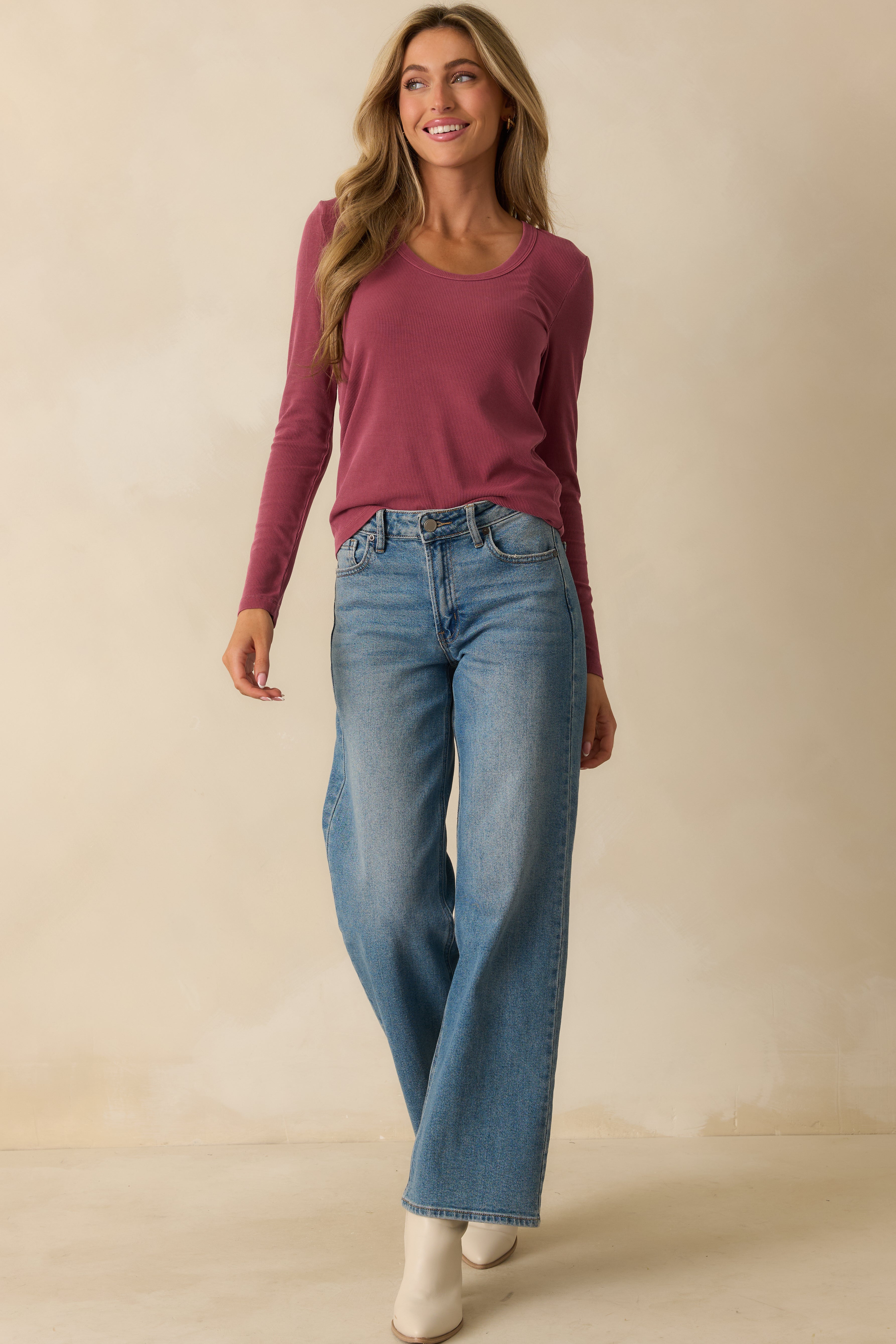 Front-facing view of the top highlighting the straight hem and slightly loose silhouette.