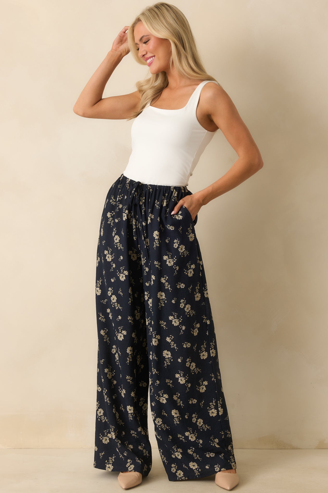 Front-facing shot of the pants, highlighting the elastic waistband and adjustable self-tie drawstring.