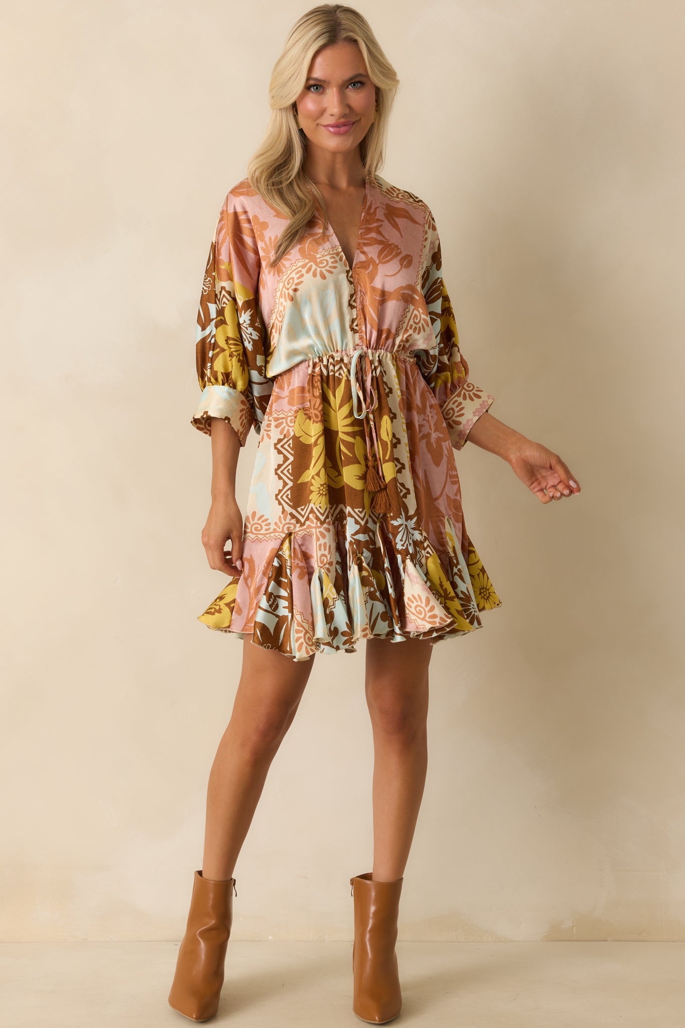 Front view of a satin-finish pink coral mini dress with cuffed 3/4 sleeves and godet hem inserts.