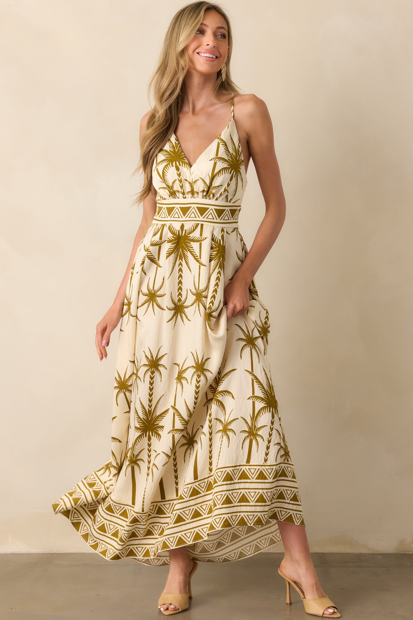 Full body front view with arms slightly out, showcasing the shape and movement of the maxi dress.