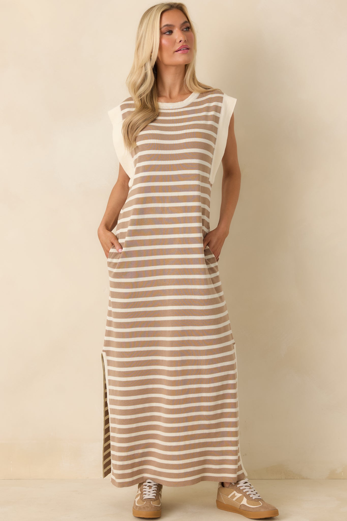 Full body front view showcasing the sleeveless design and subtle side slits for ease of movement.