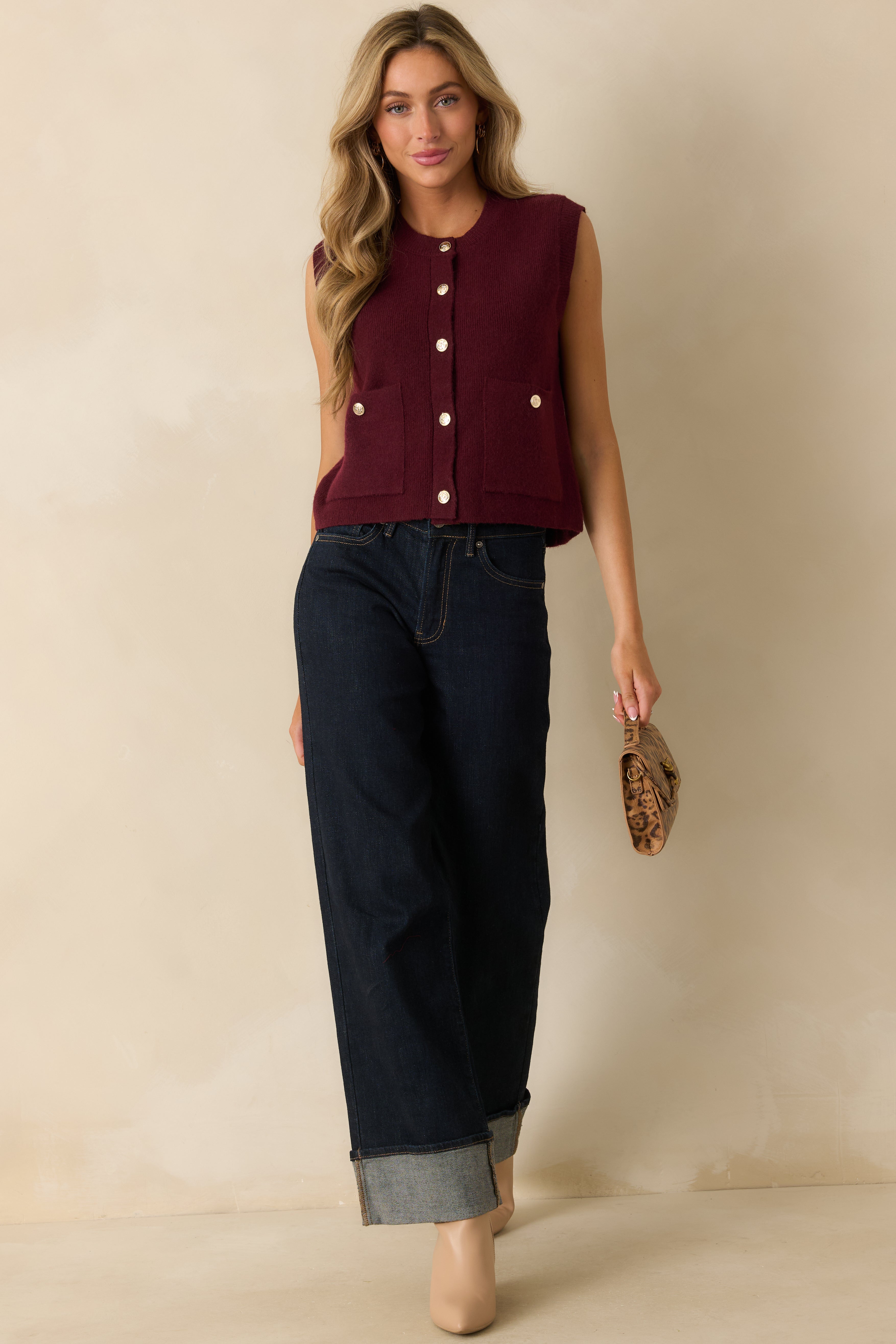 Front-facing view highlighting the two front patch pockets with matching gold buttons.