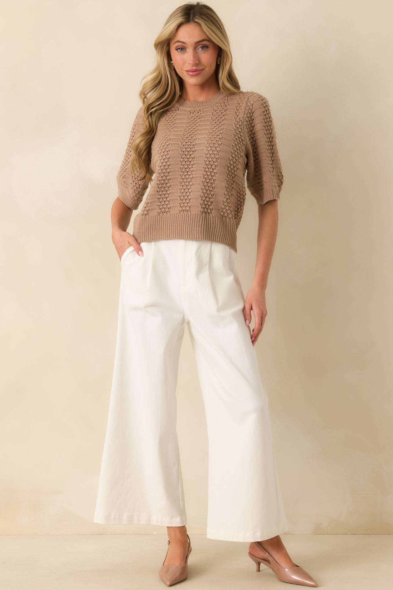 Front-facing view of the sweater, highlighting the vertical crochet and ribbed panels and the relaxed fit across the body.