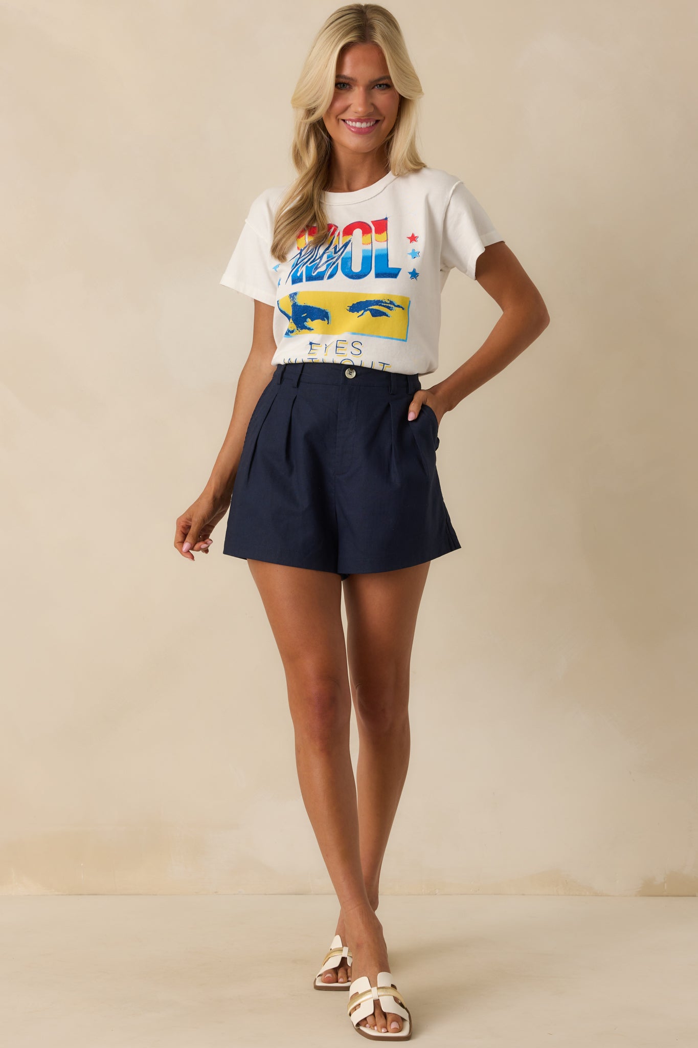 Front view of the white Billy Idol tour T-shirt displaying reverse seam detailing, classic crew neck, short sleeves, and centered concert graphic.