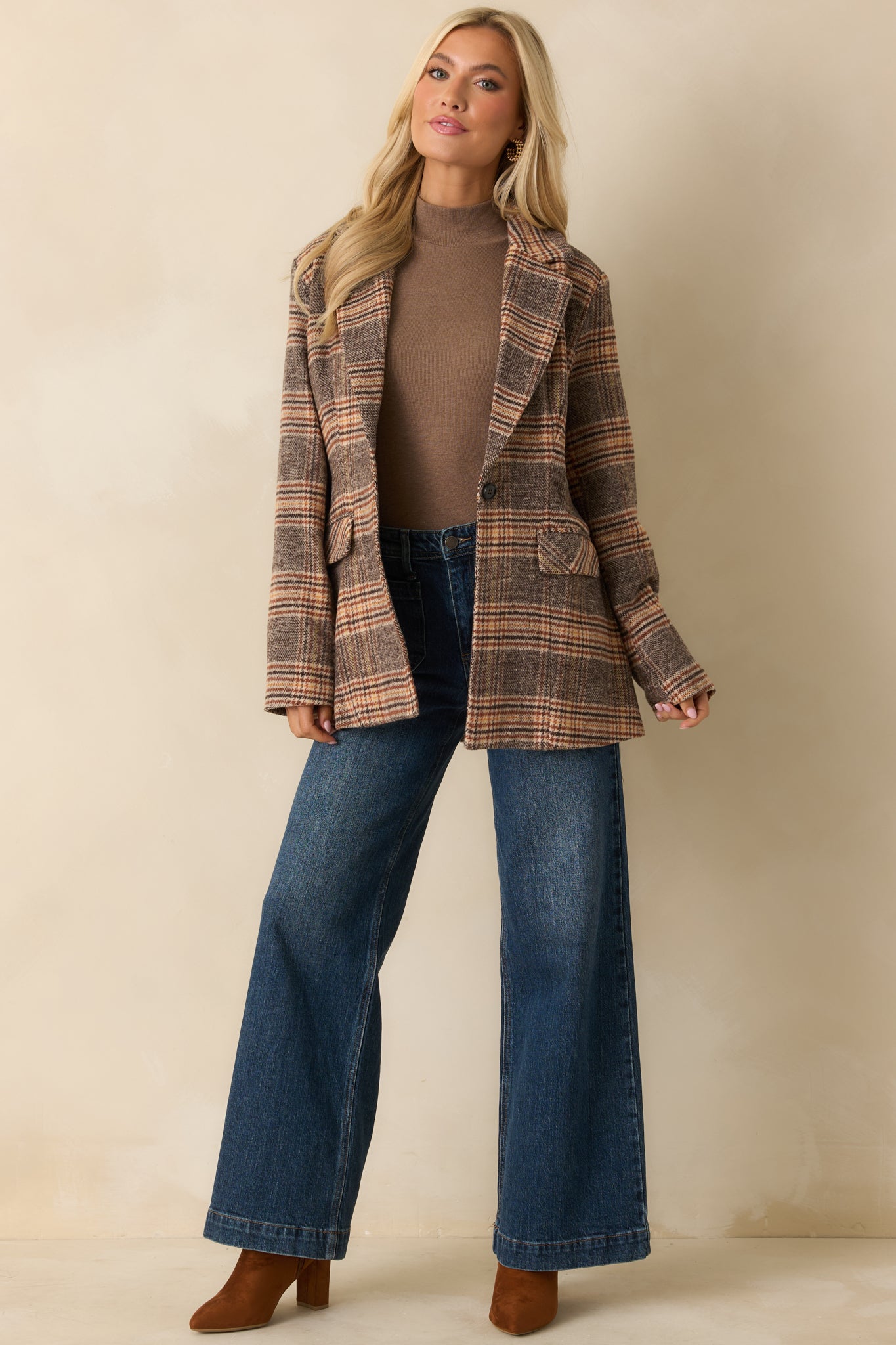 Front view of wide-leg jeans highlighting the relaxed silhouette, belt loops, and faded wash.