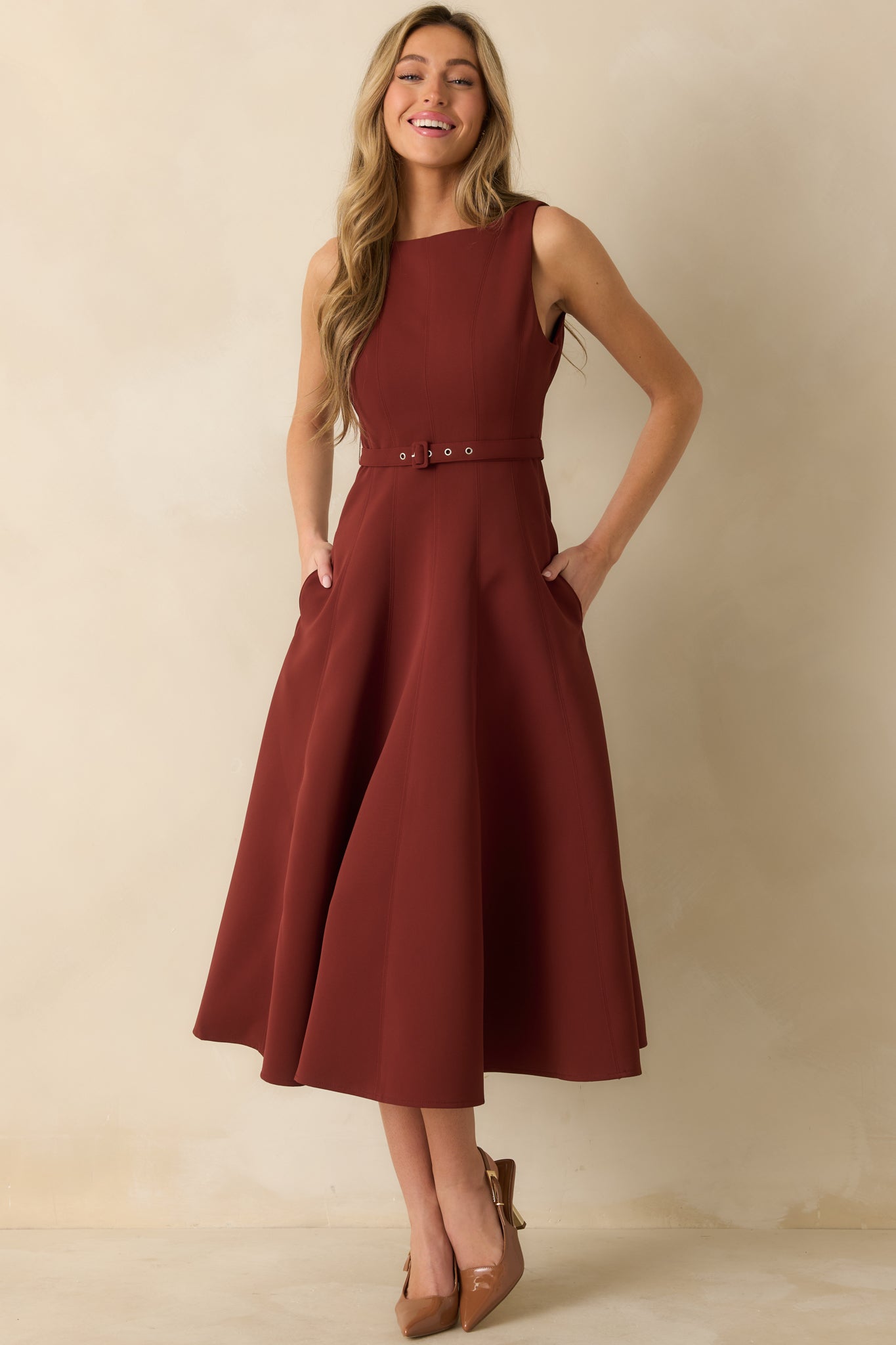 Front view of wine red midi dress with fitted bodice, seamed detailing, and flowing A-line skirt.