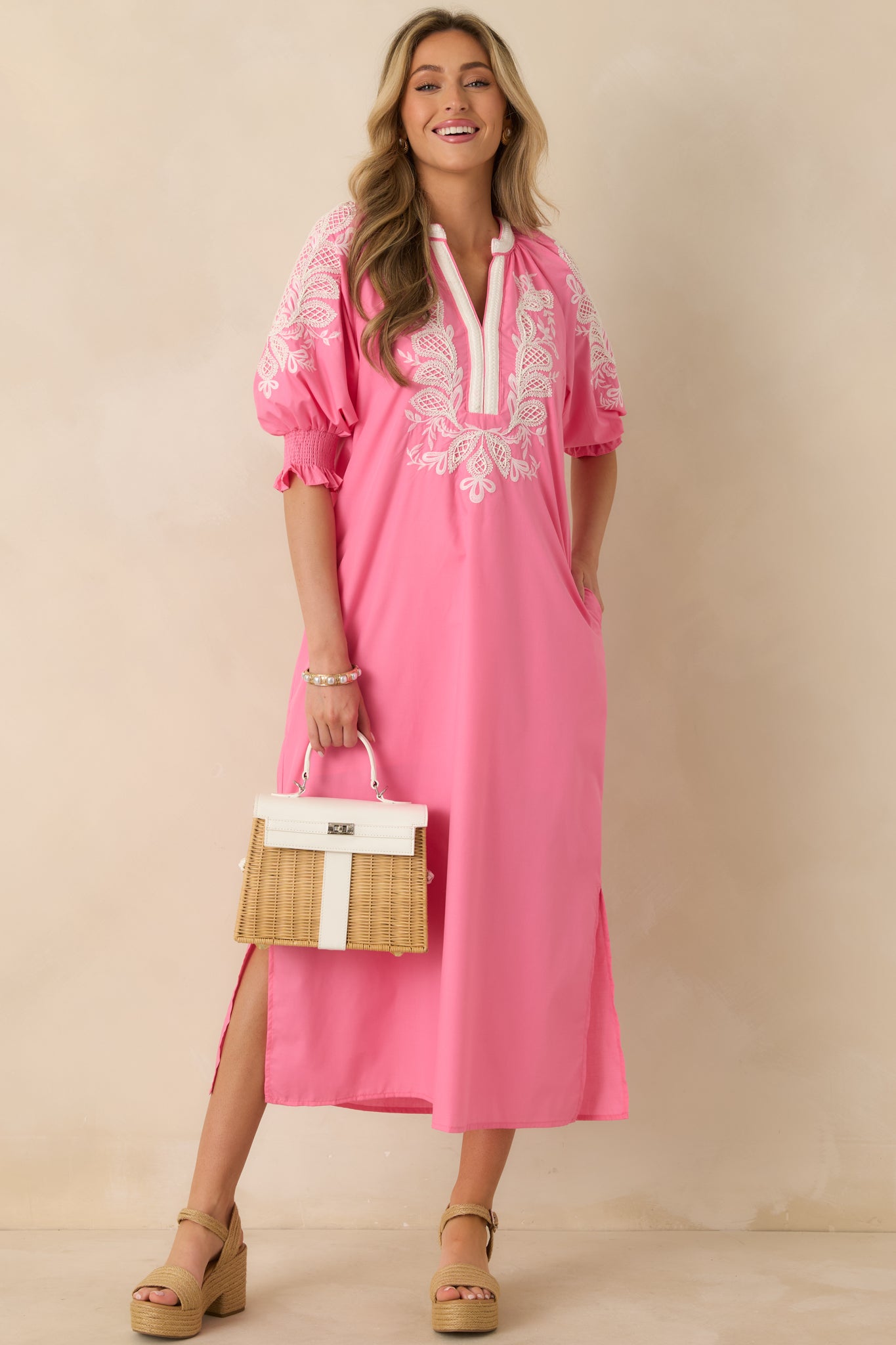 Front-facing view emphasizing elbow-length puff sleeves, smocked cuffs, and airy maxi skirt.