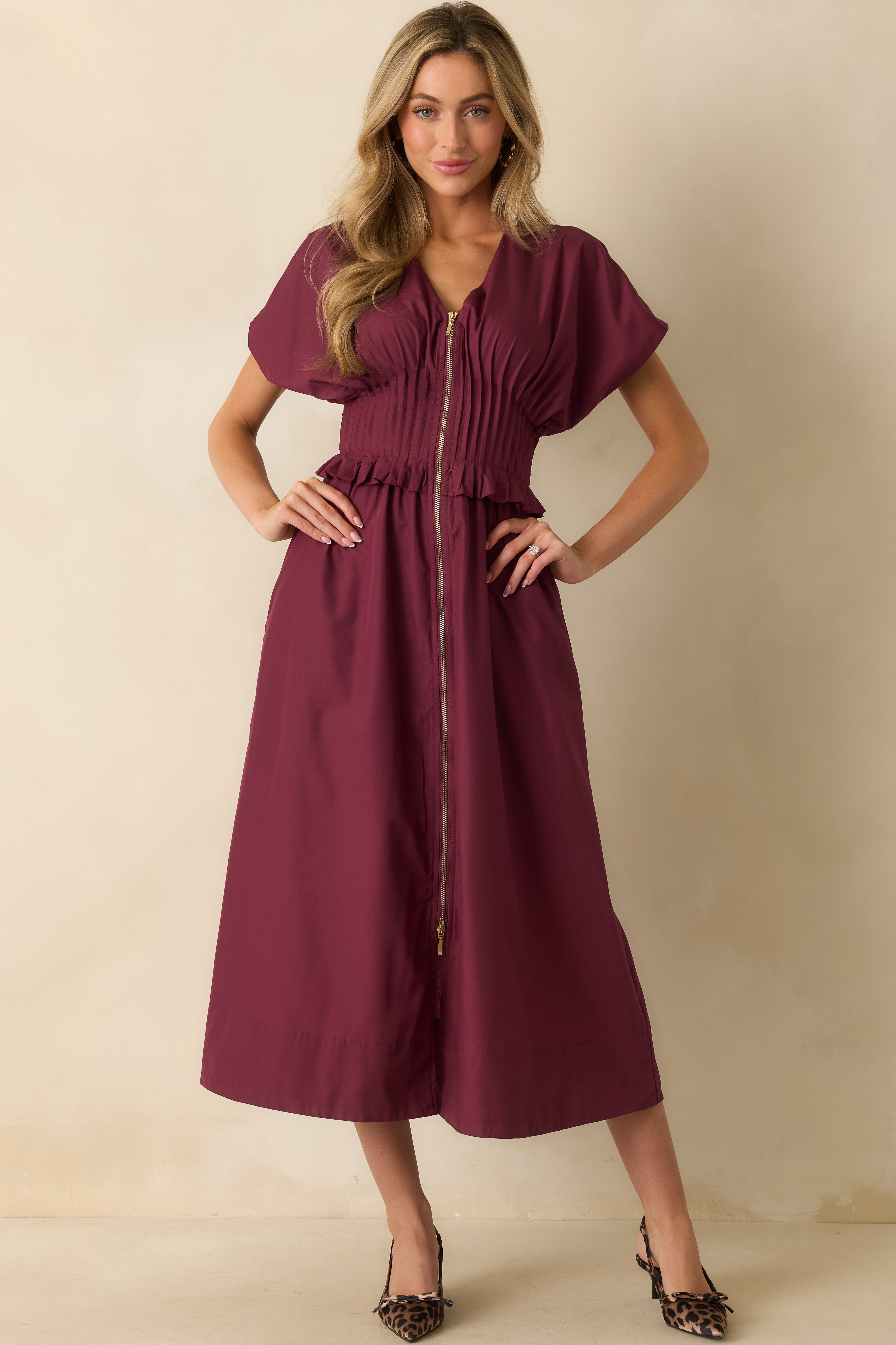 Straight front view emphasizing the smooth drape of the woven fabric and side pocket detail.