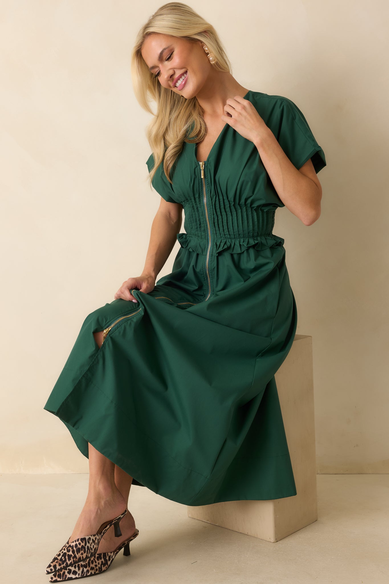 Woven maxi dress styled front-facing to highlight the A-line skirt, ruffled smocked waistband, and side pockets.