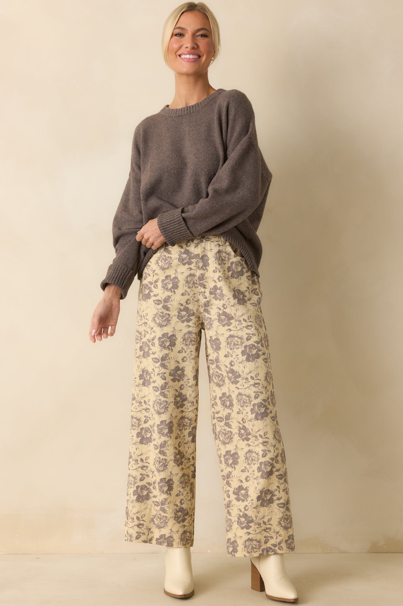 Front-facing woven pants highlighting front pockets, belt loops, and relaxed wide-leg fit.