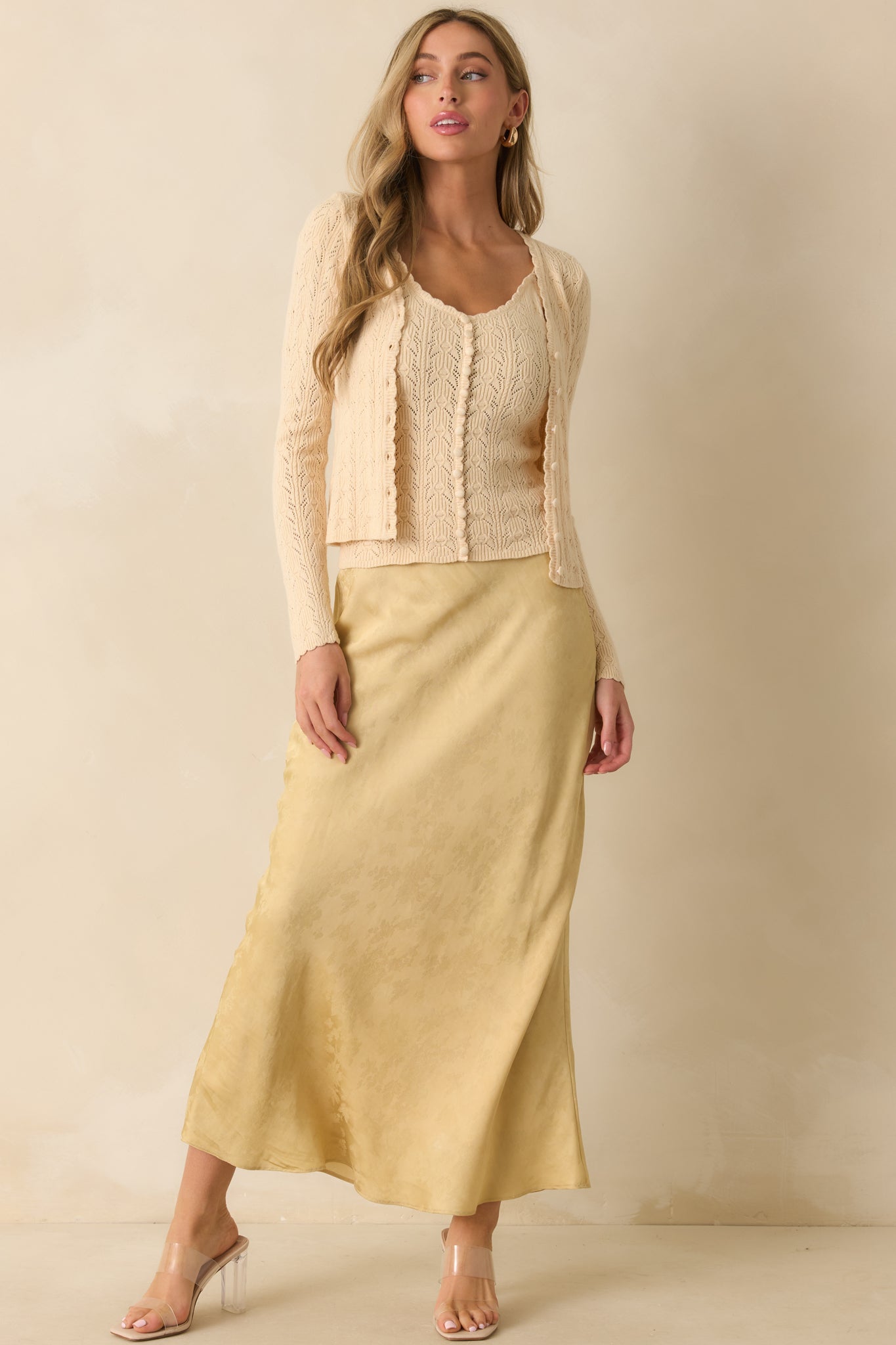 Full-length front view showing scallop-trimmed v-neck and faux button detail on ivory camisole.