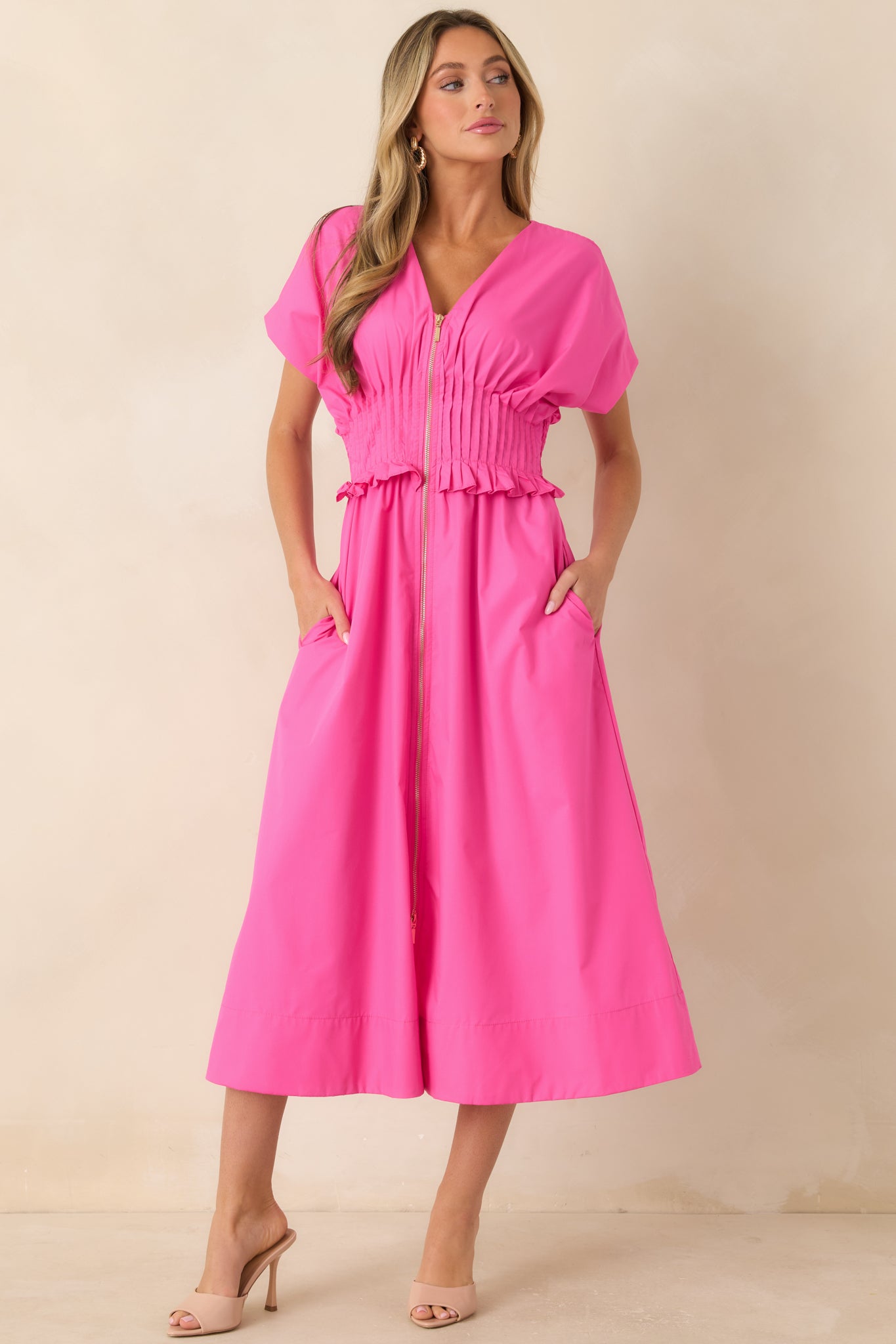 Fuchsia maxi dress with a relaxed fit, V-neckline, and softly draped A-line skirt.