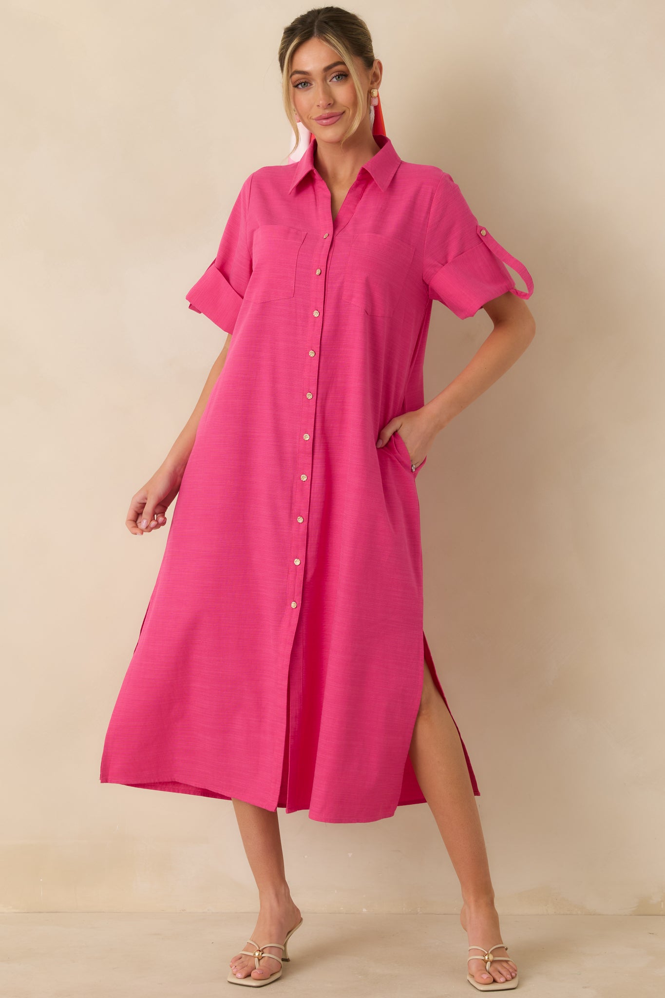 Fuchsia midi shirt dress in lightweight cotton with a collared neckline, full gold-tone button-front closure, and a relaxed straight silhouette.