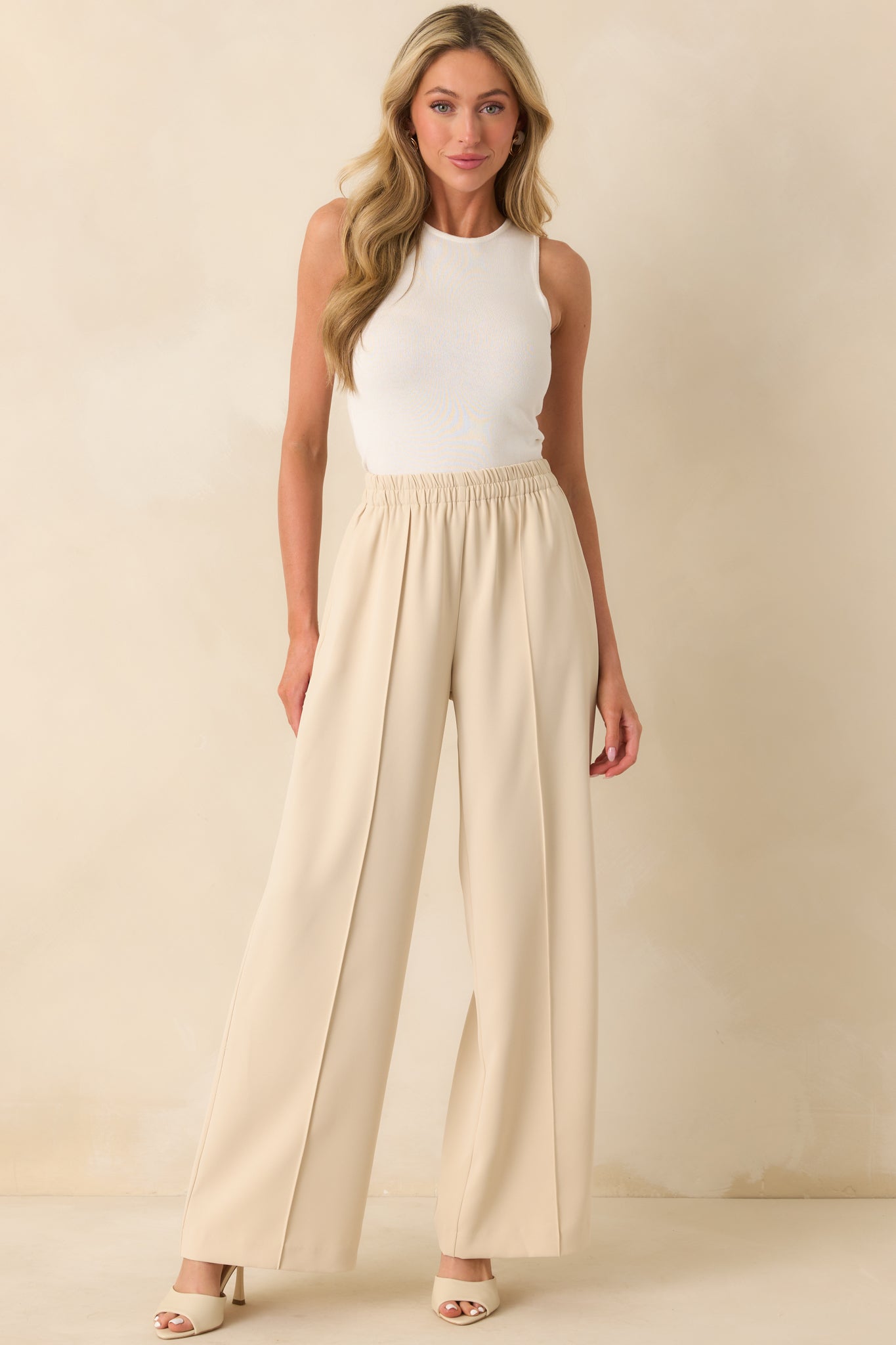 Full body image emphasizing the clean silhouette and functional hip pockets.

