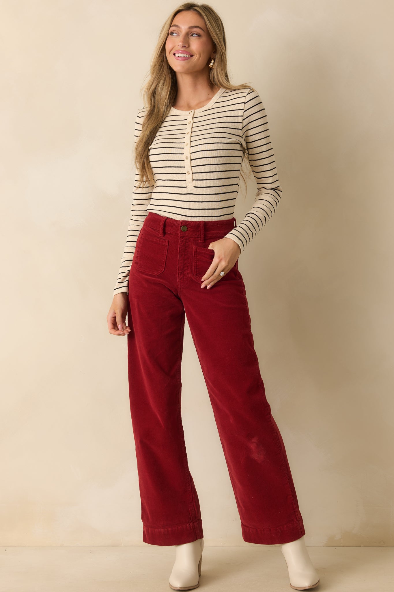 Full body front view highlighting the long sleeves and partial button front placket.