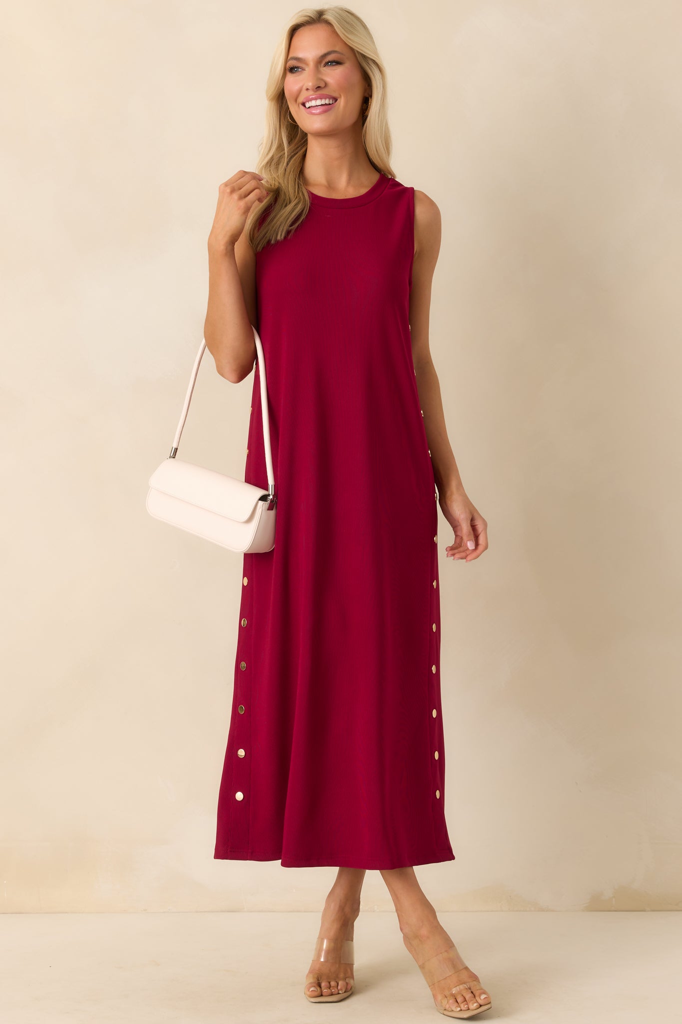 Full body front view of the burgundy maxi dress featuring a crew neckline and sleeveless design.