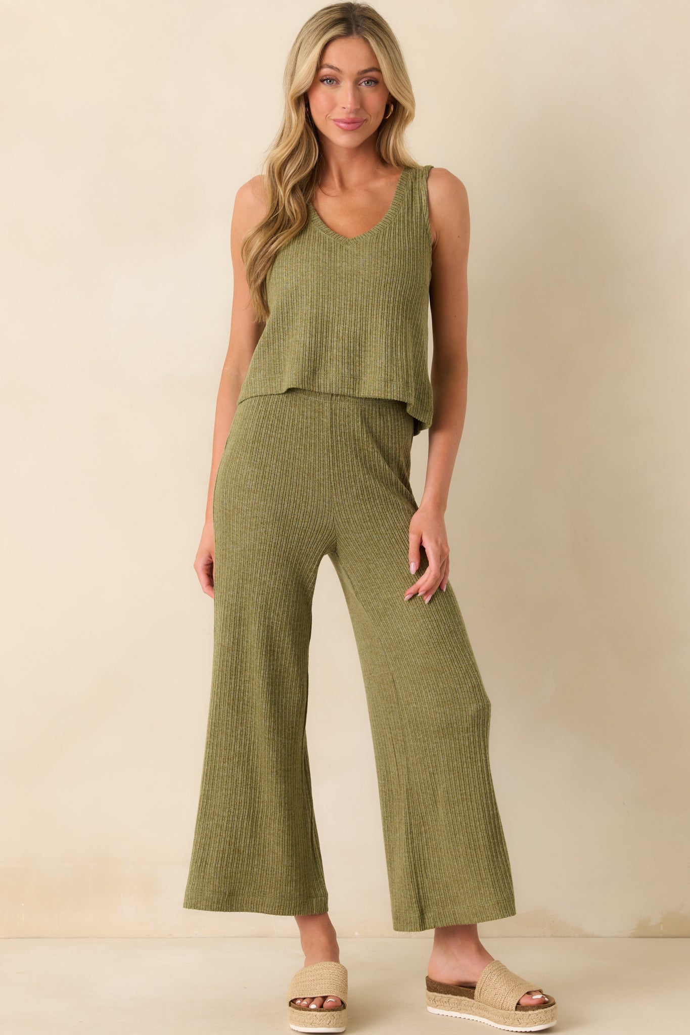 Full body image capturing the casual silhouette and smooth texture of the top.