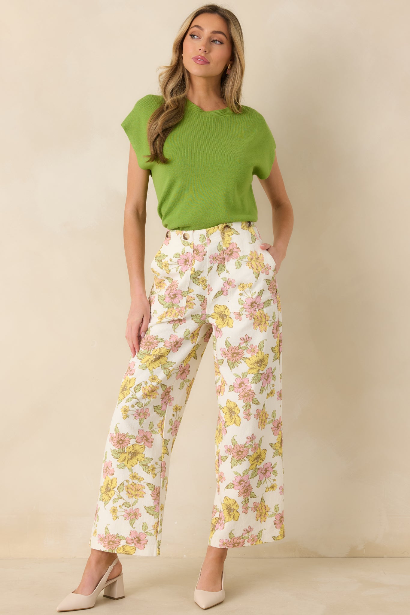 Front-facing full body image of the knit sweater showcasing the short relaxed sleeves and clean hem finish.