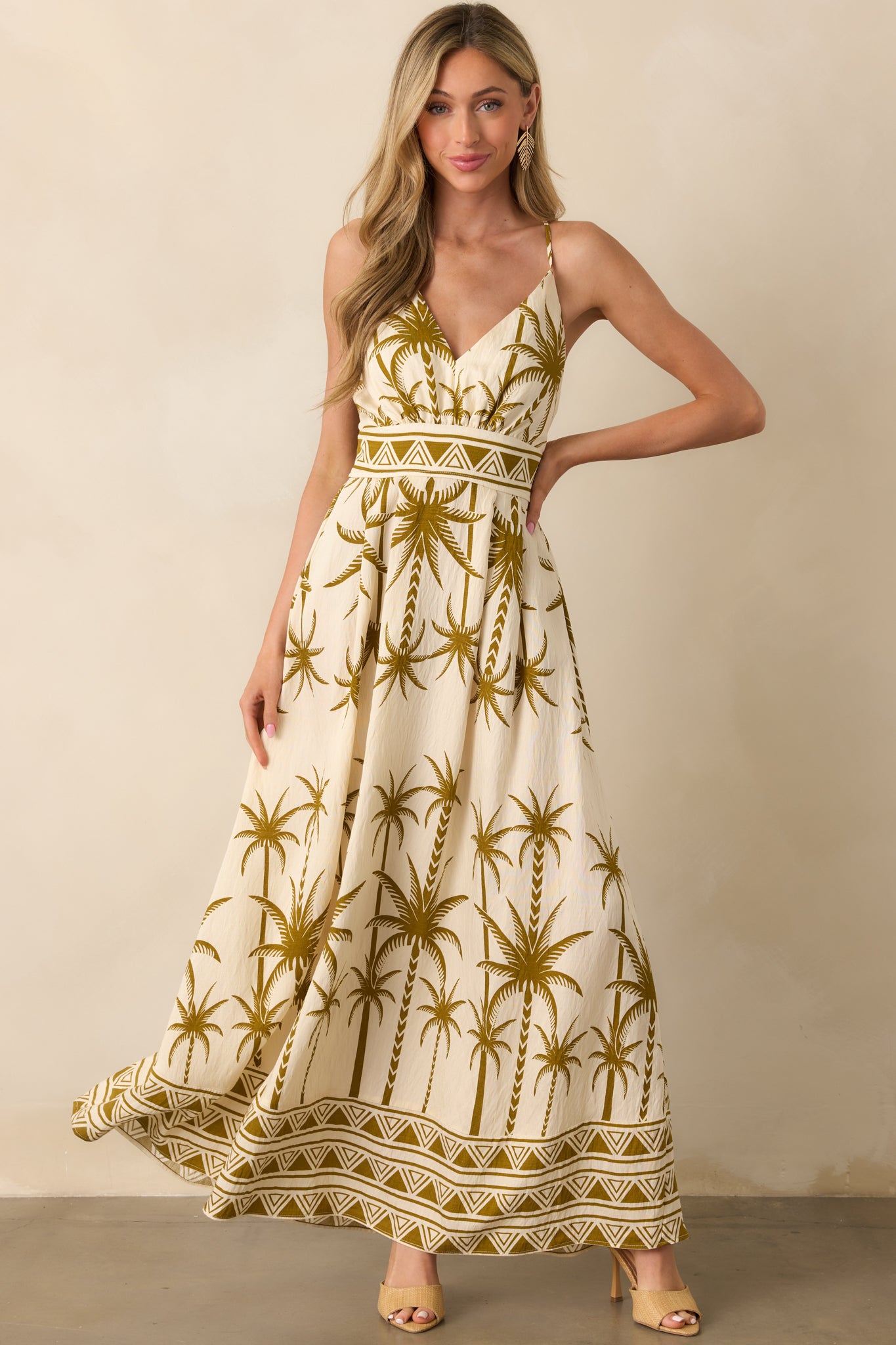 Full body front pose emphasizing the deep v-neckline and tropical pattern.