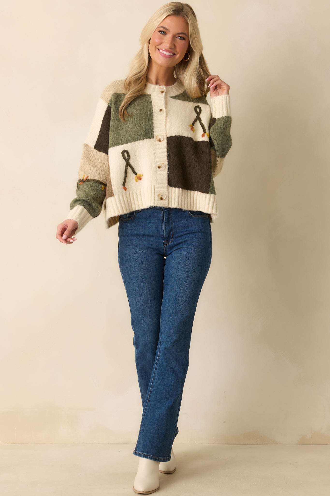 A full body view highlighting the relaxed fit and raised floral embroidered detailing across the front.