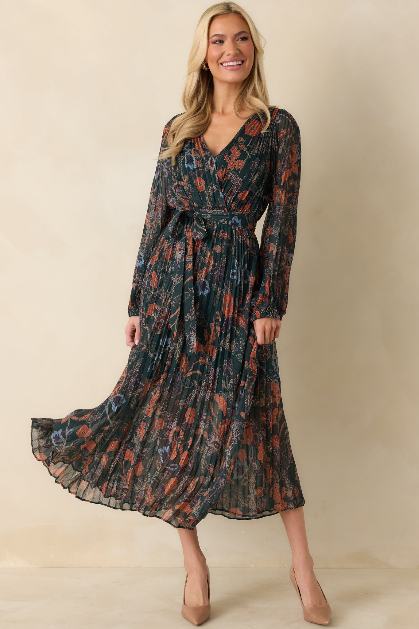 Full body perspective highlighting the removable waist tie and elastic cuffs on the long sleeves.