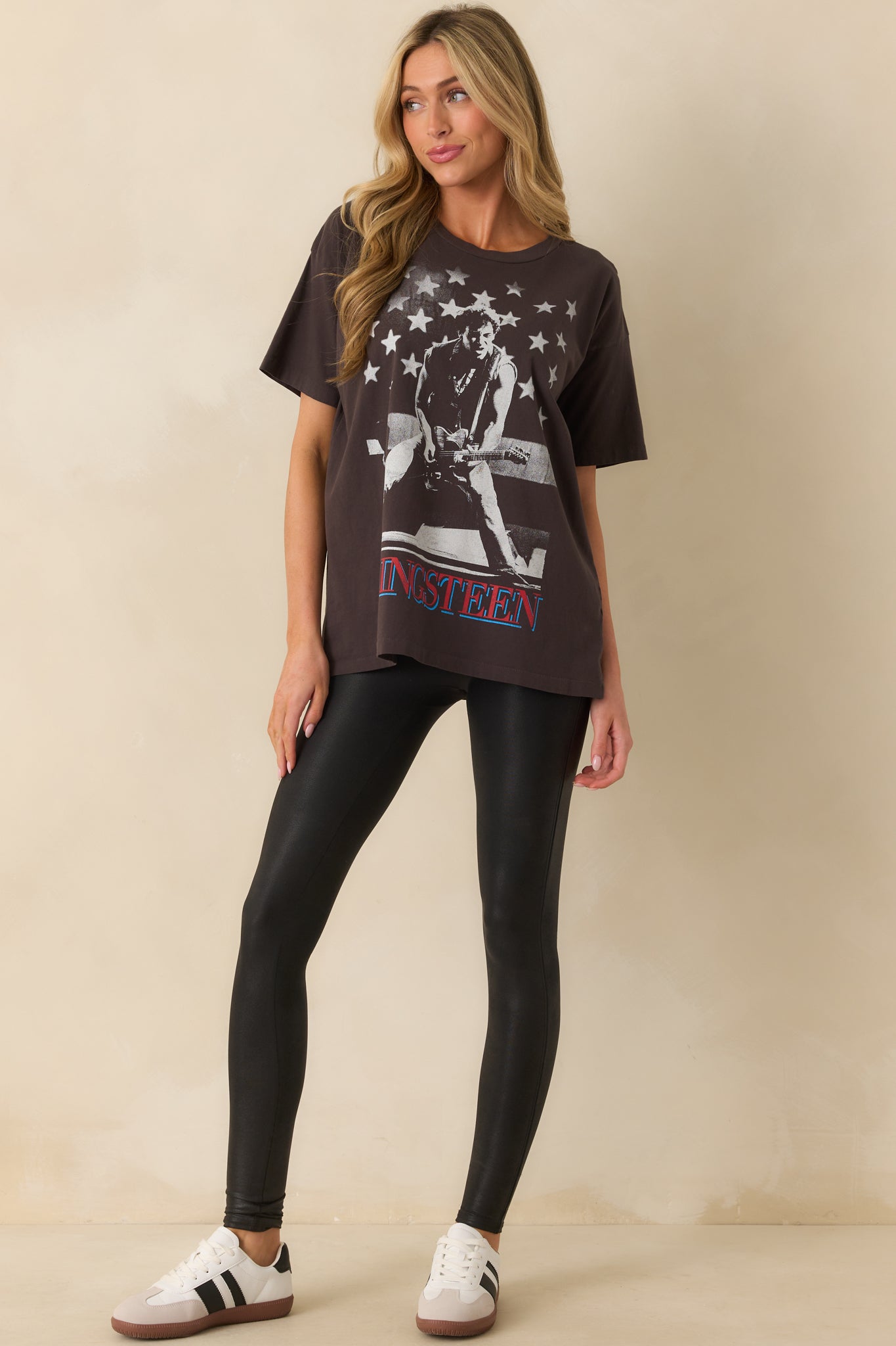 A full body shot highlighting the short sleeves and relaxed silhouette of the cotton graphic tee.