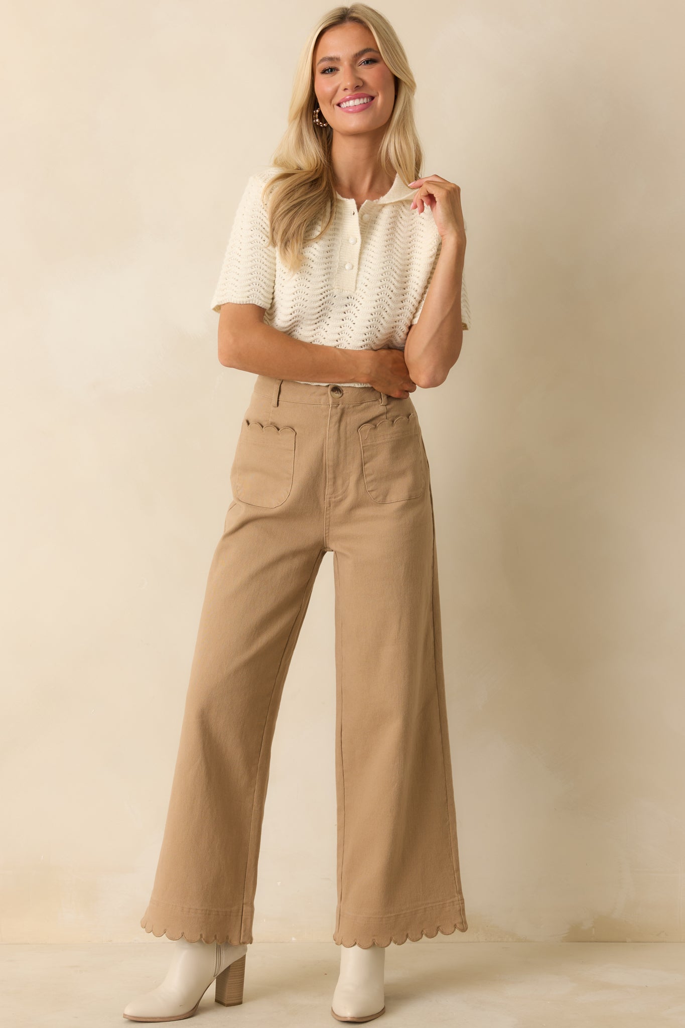 Full body image emphasizing the short sleeves and overall scalloped pointelle texture of the ivory top.