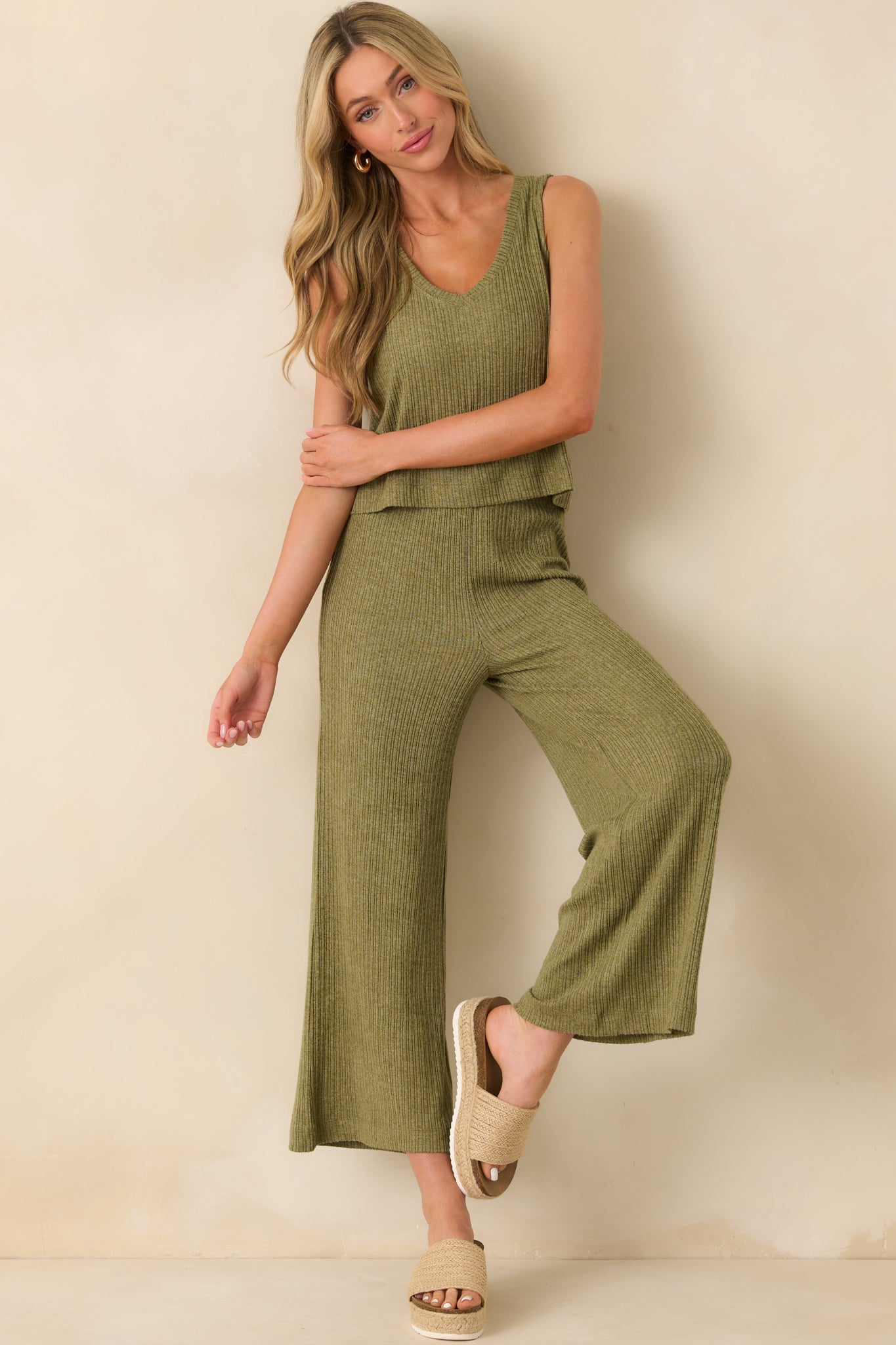 Full body view of the olive green pants showing the wide leg silhouette and high rise elastic waistband.