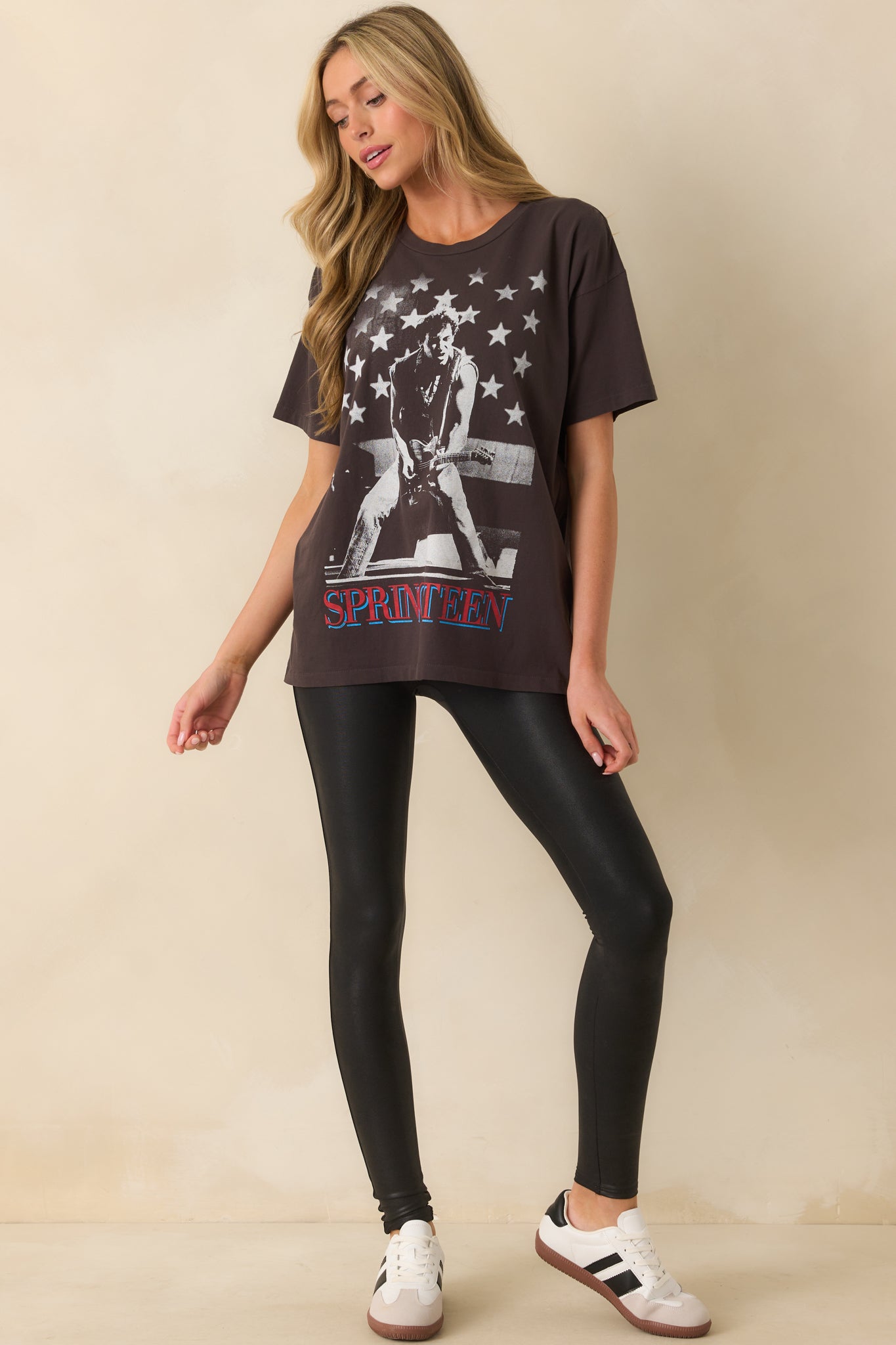 A full front view of the black Bruce Springsteen tee with a bold star-accented graphic and oversized fit.