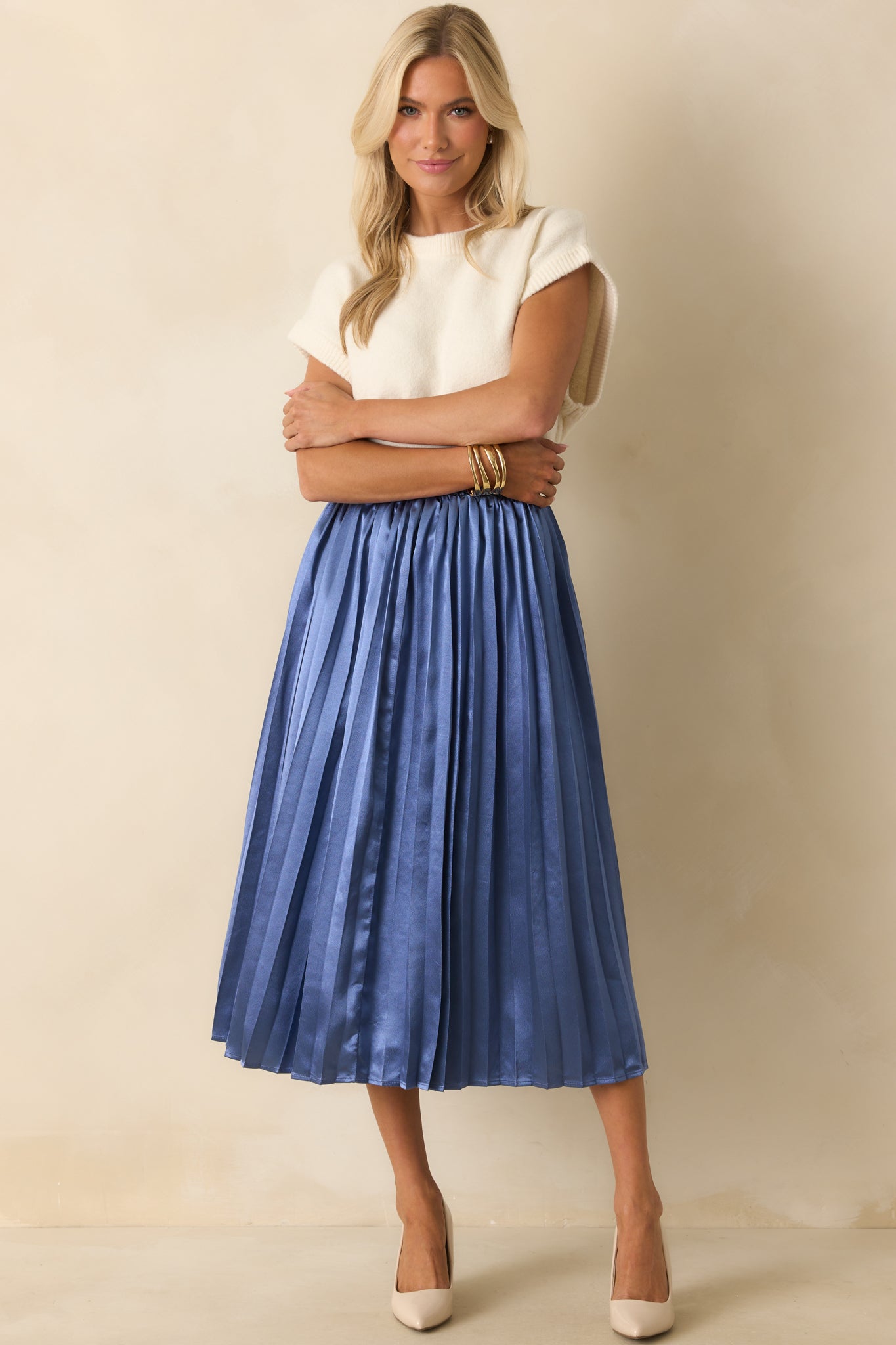 A full front view of the dusty blue skirt with elastic waistband and midi length.
