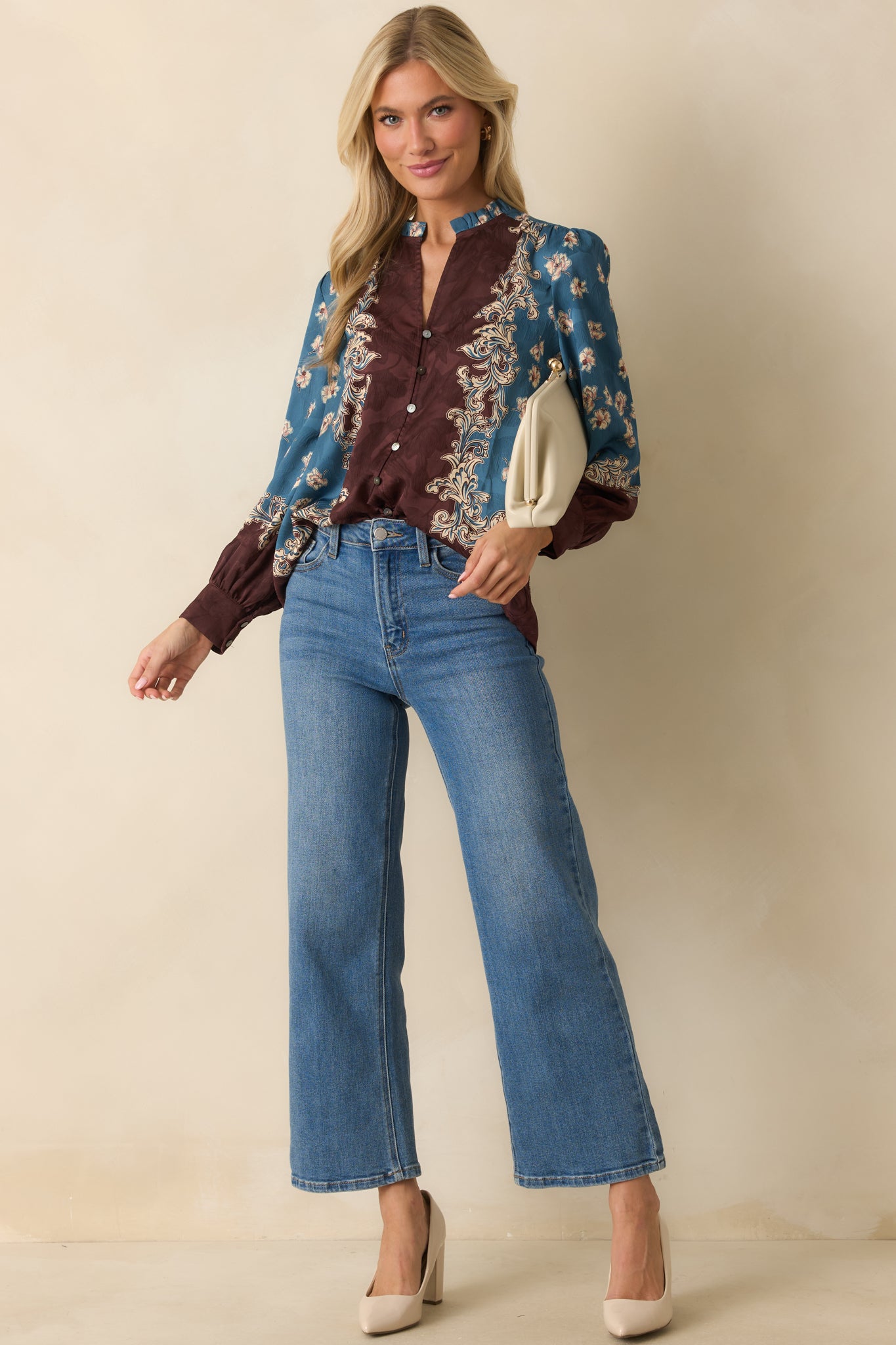 A full front-facing view highlighting the long balloon sleeves and relaxed silhouette.