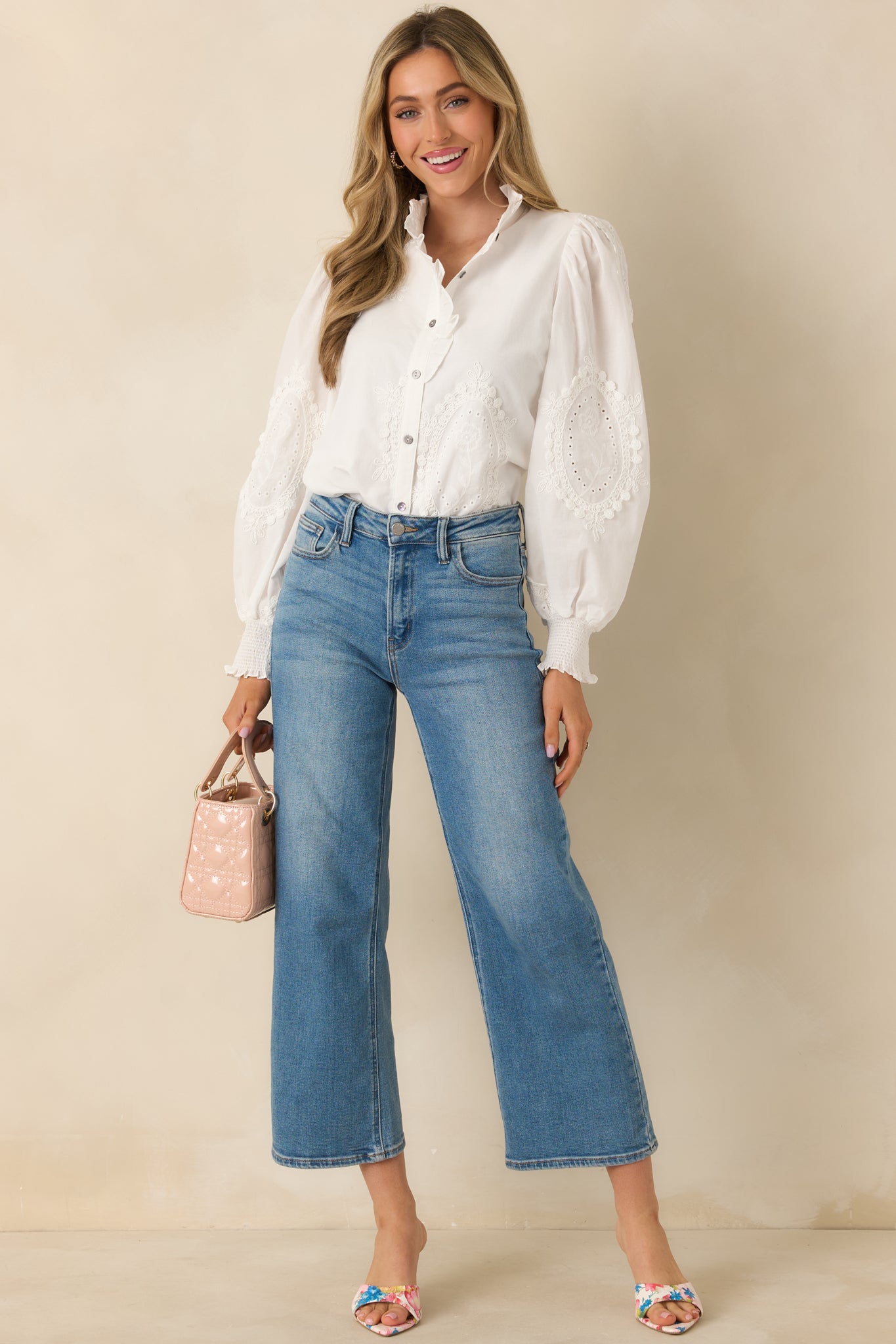 Front-facing full body image highlighting the lightweight woven fabric and relaxed long sleeve silhouette.