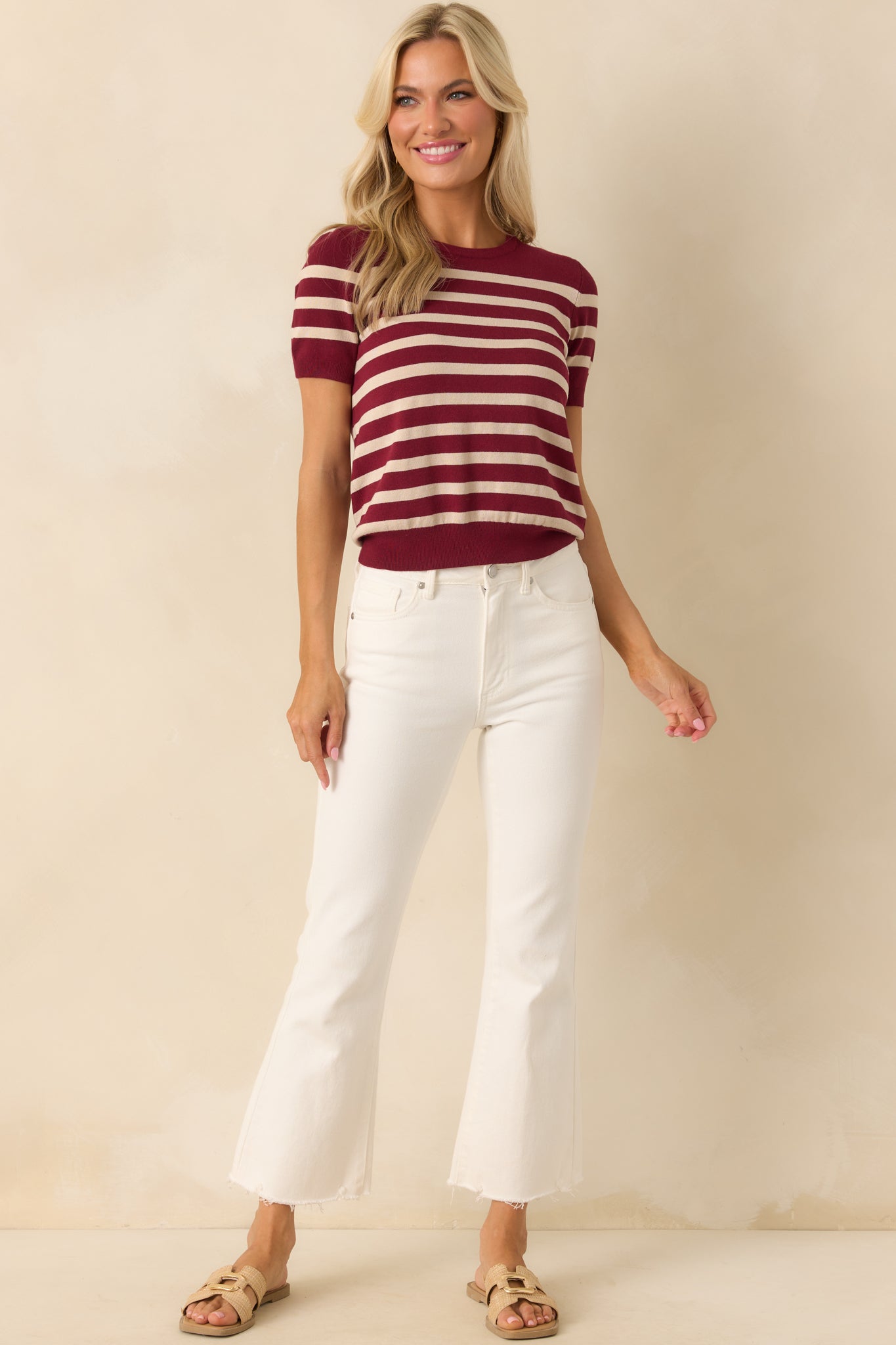 Front-facing full length image highlighting the lightweight knit fabric and fitted bottom hem.
