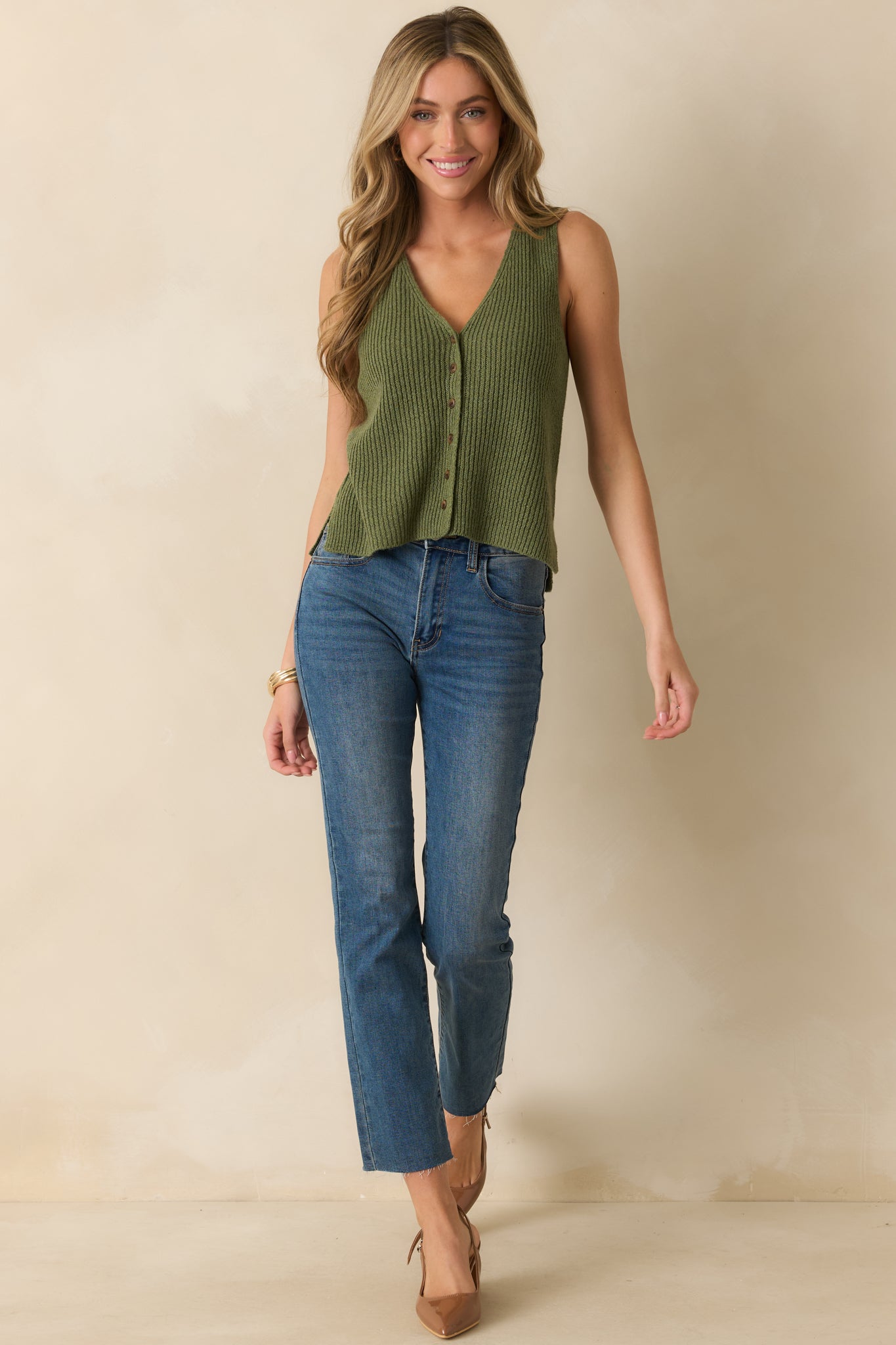 Dark wash high rise jeans shown in full length with straight leg fit and functional belt loops