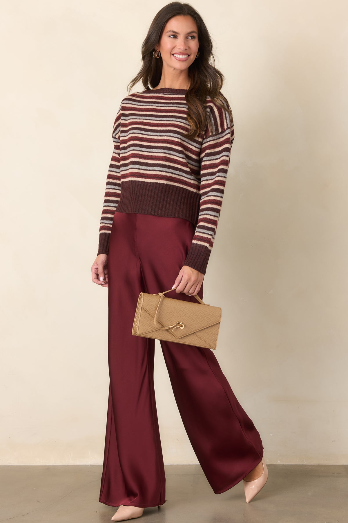 Full-length wide-leg pants featuring a polished flat-front waistband and flexible elasticized back for a comfortable fit.