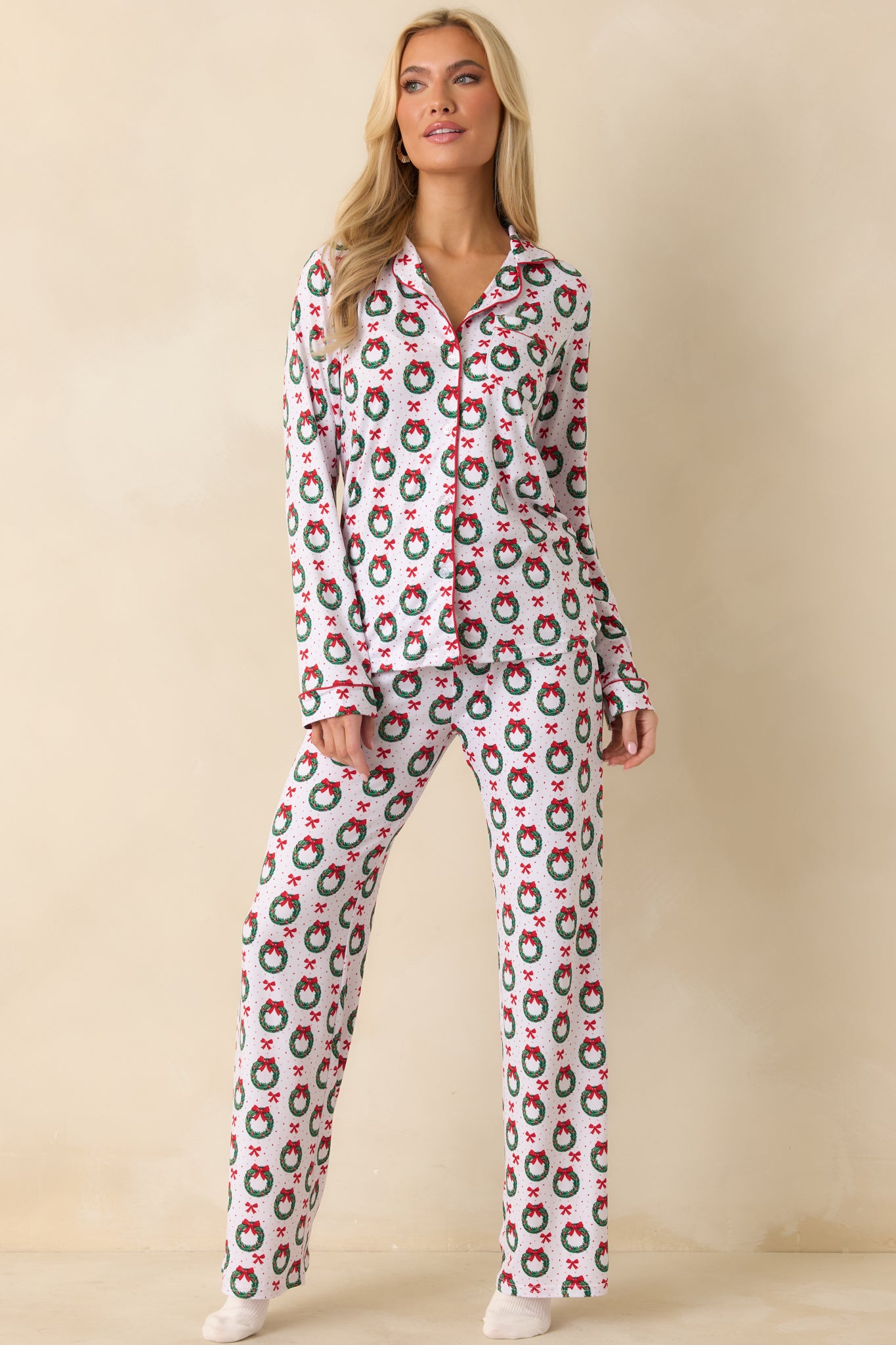 Full-length front view showing the straight hem, button details, and overall festive pattern.