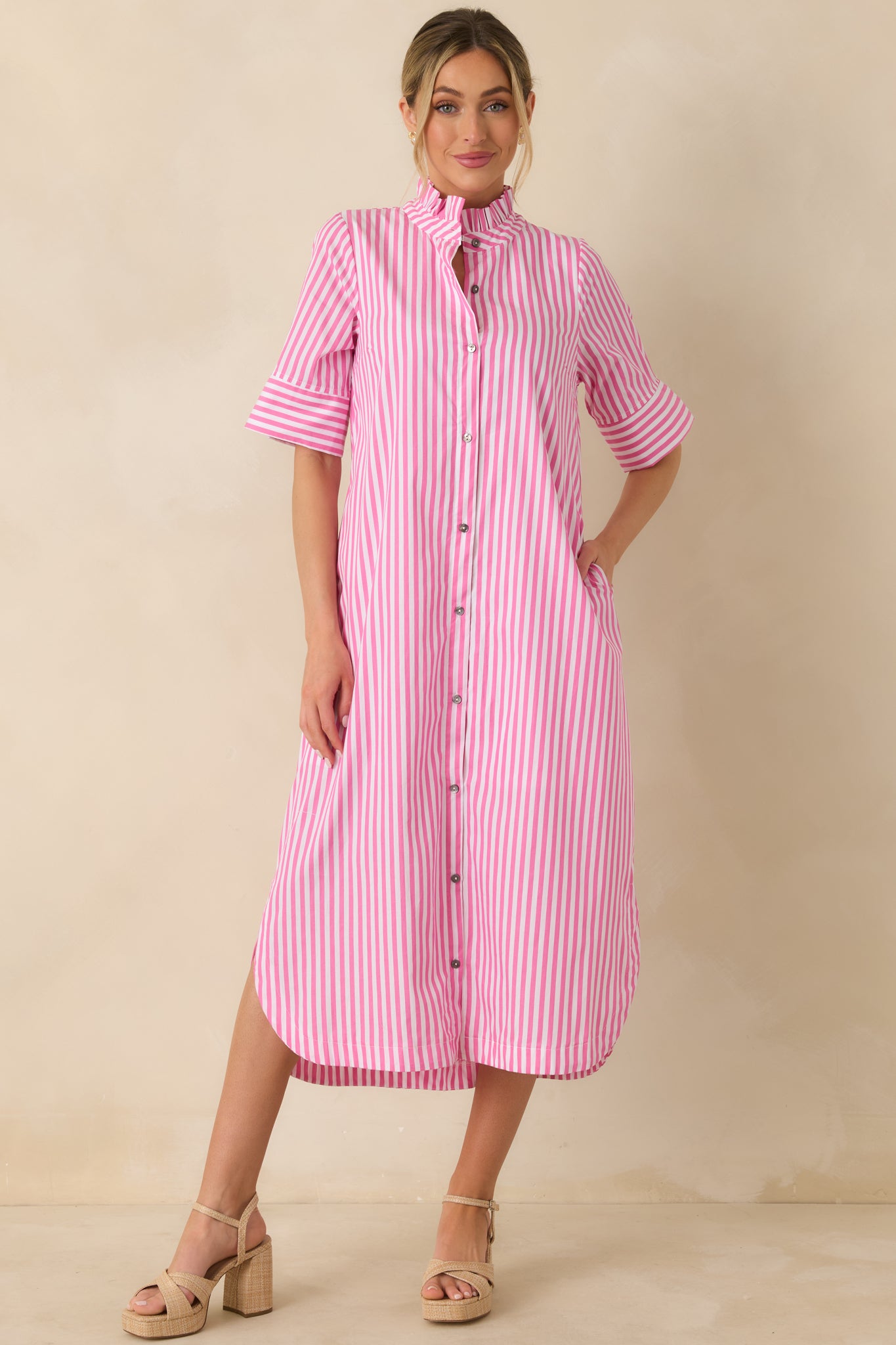 Full length front view focusing on the dress’s relaxed fit through the skirt and flattering drape.