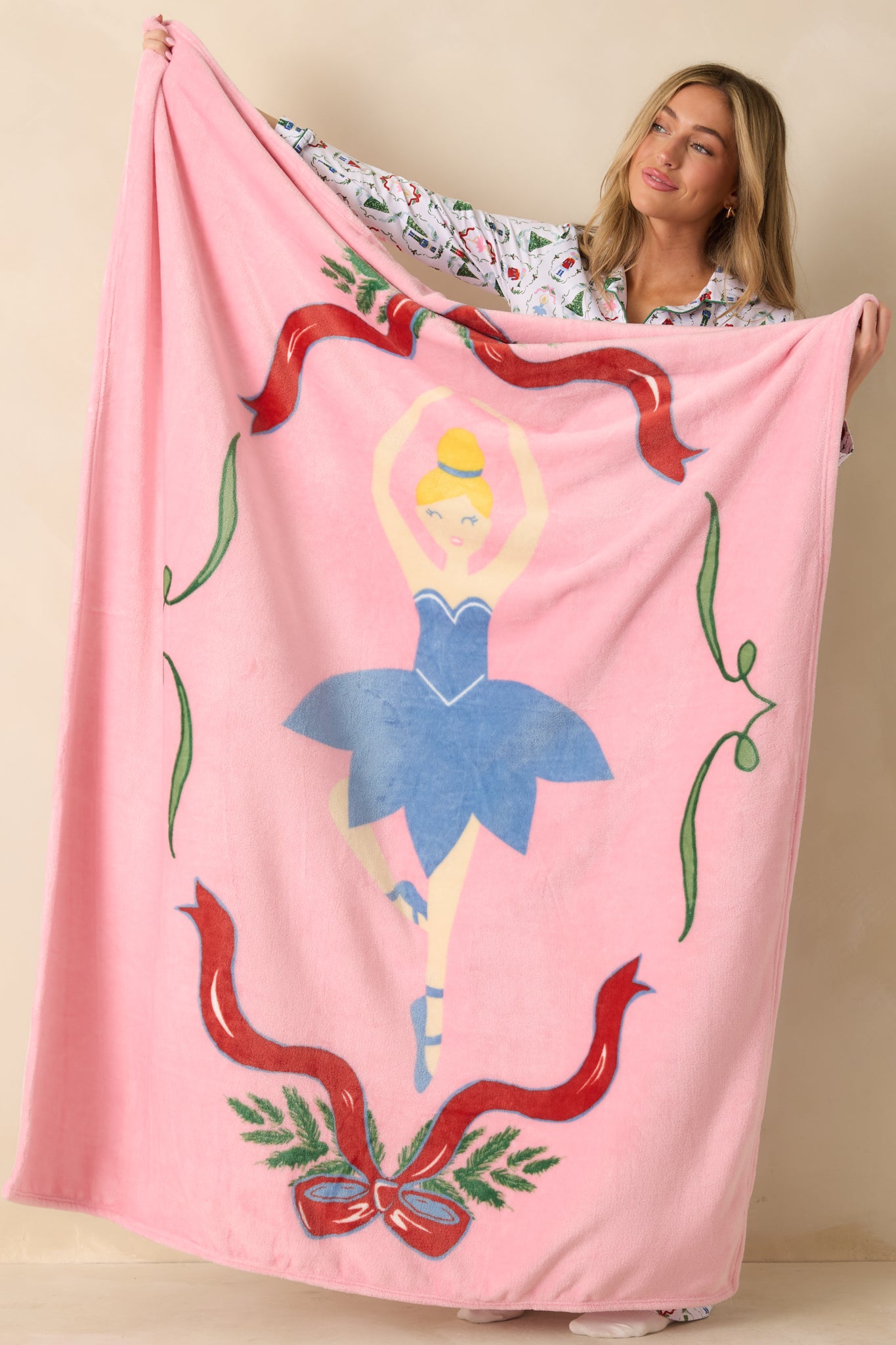 Full-length view highlighting the plush fabric and colorful holiday-themed ballerina design.
