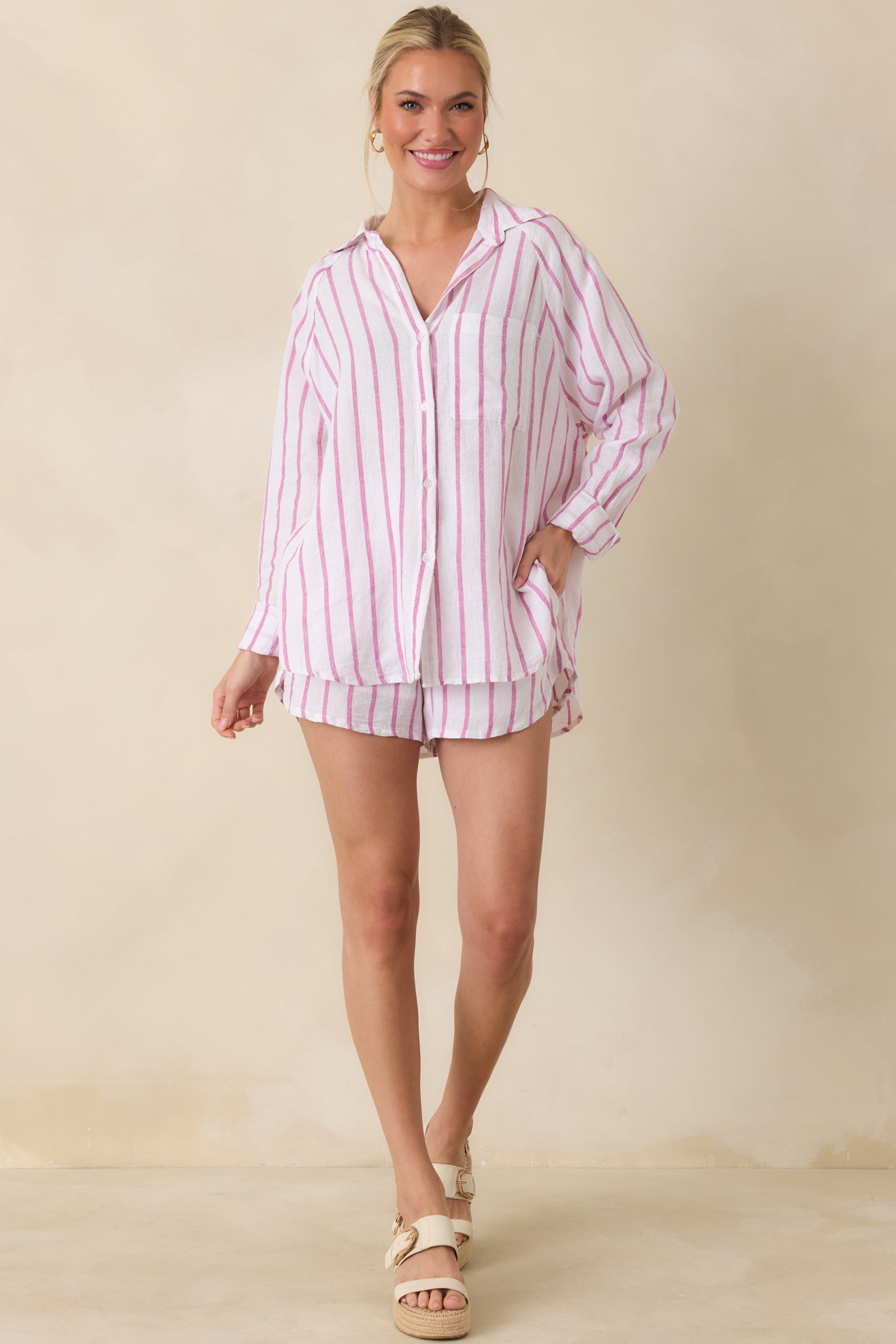 Full-length top with collared neckline, long sleeves, and vertical pink stripes for a fresh, coastal-inspired look.