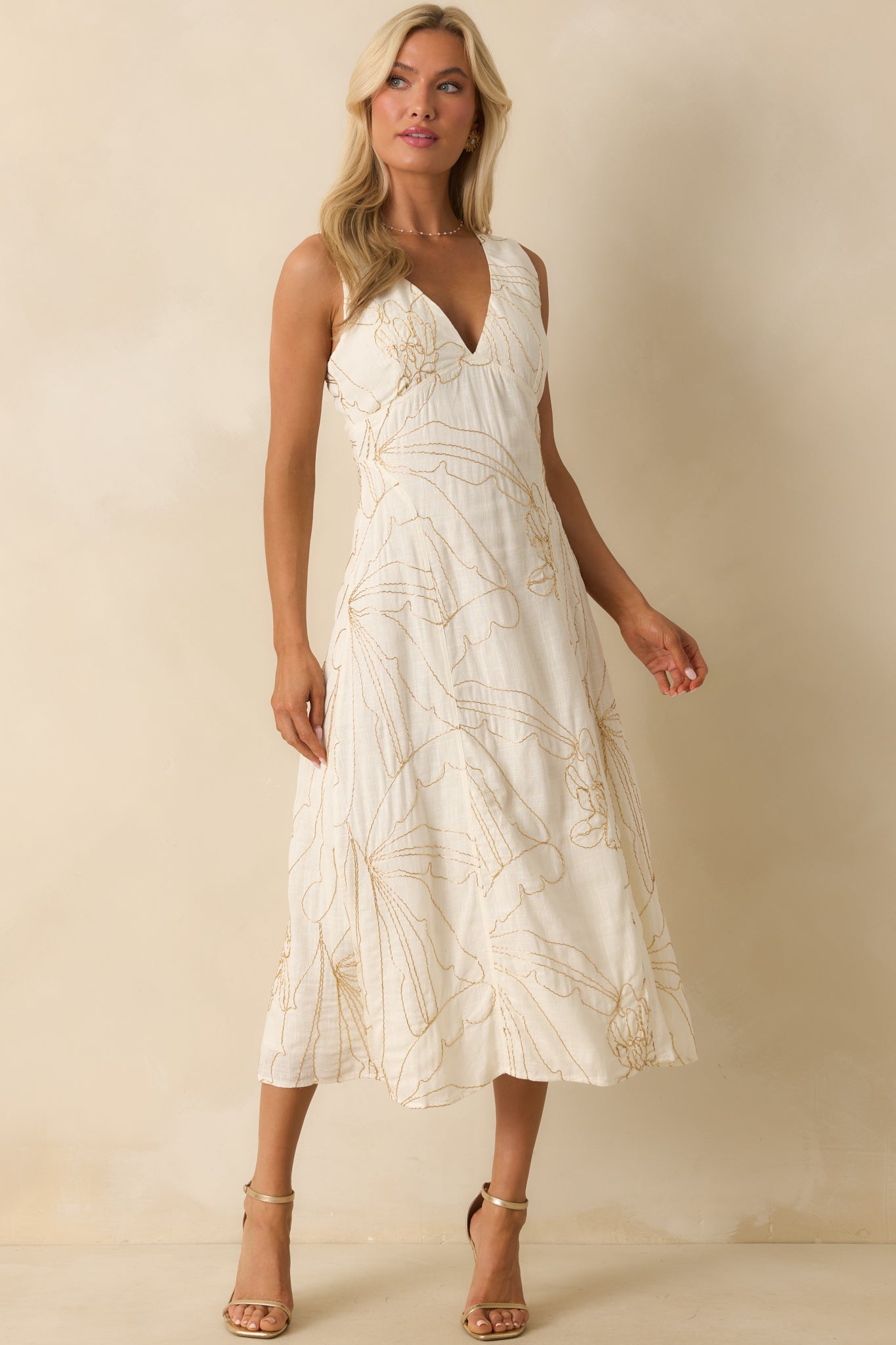 Full-length view emphasizing the airy flow of the skirt and elegant embroidery.